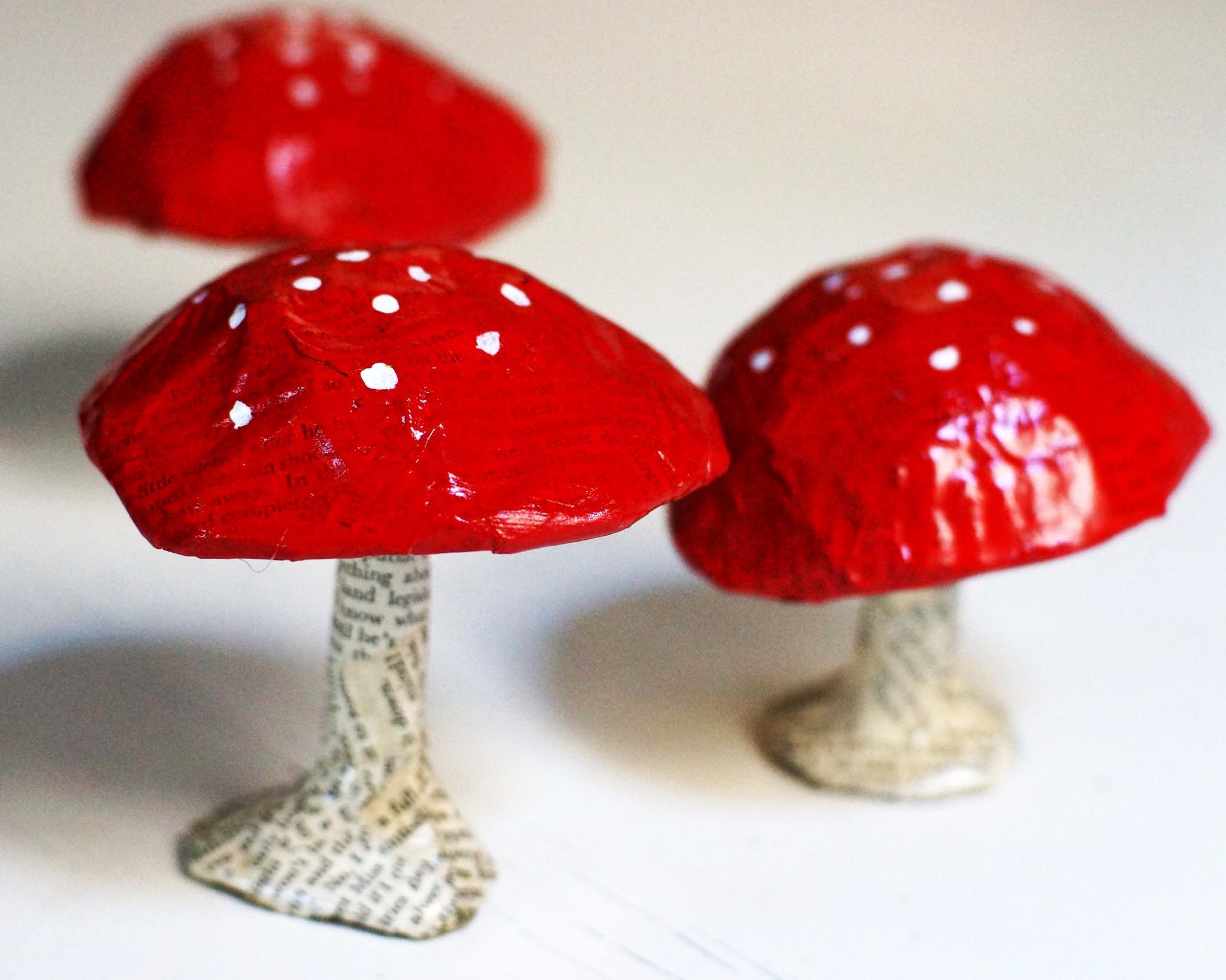 trio of paper mache toadstools