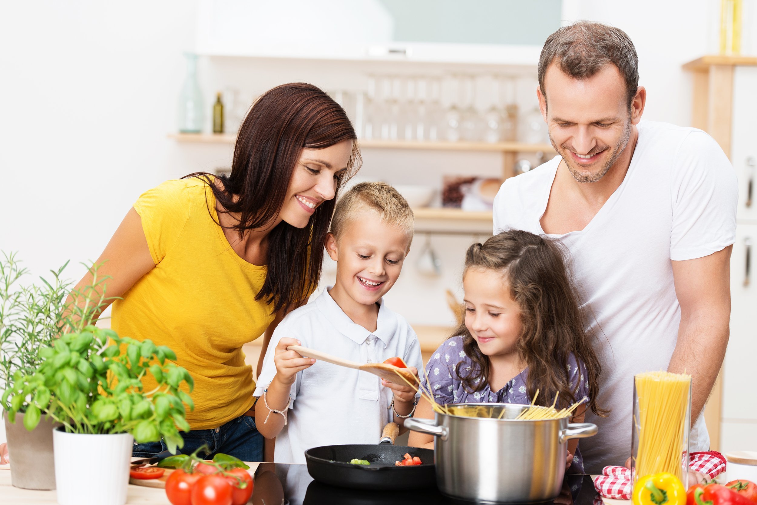 family cooking together in the kitchen