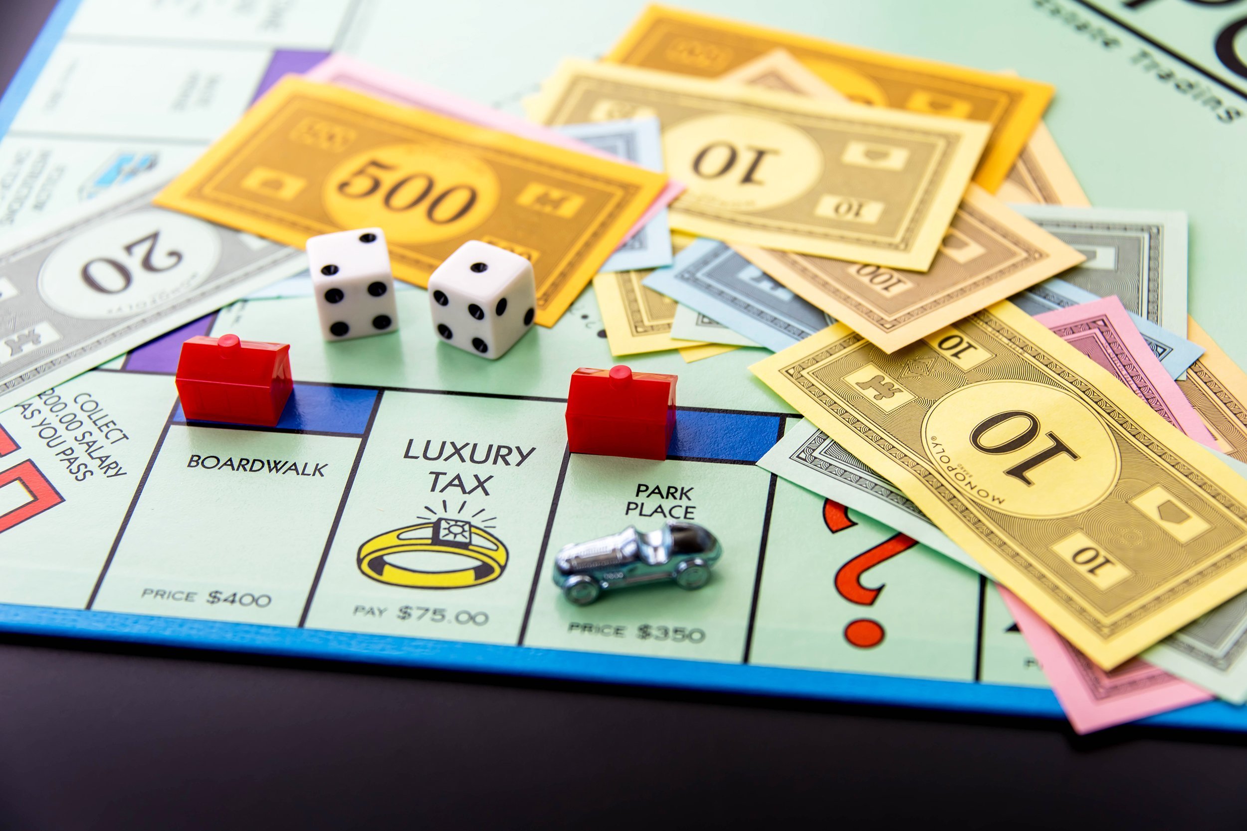 Monopoly game board with car on Park Place