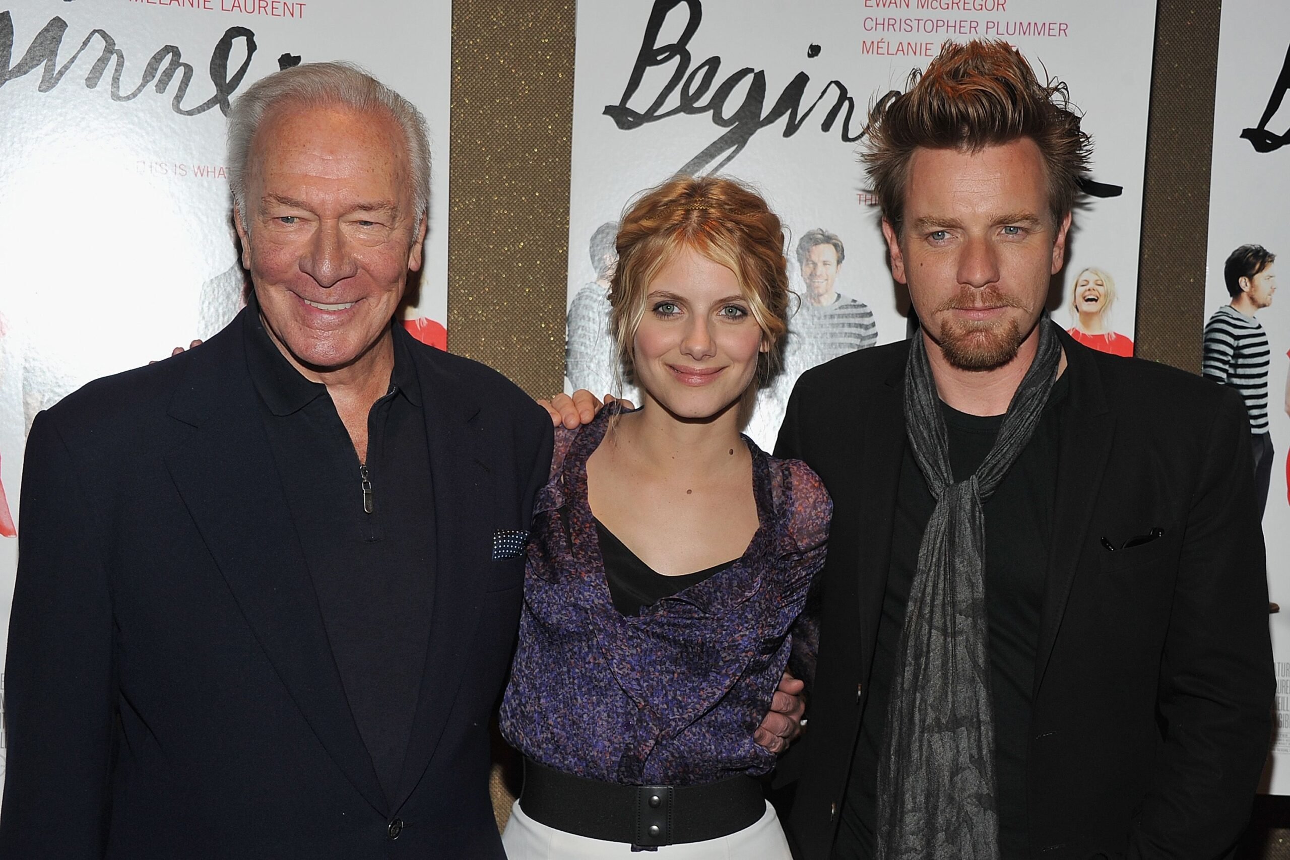 lead actors posing in front of movie posters at new york screening