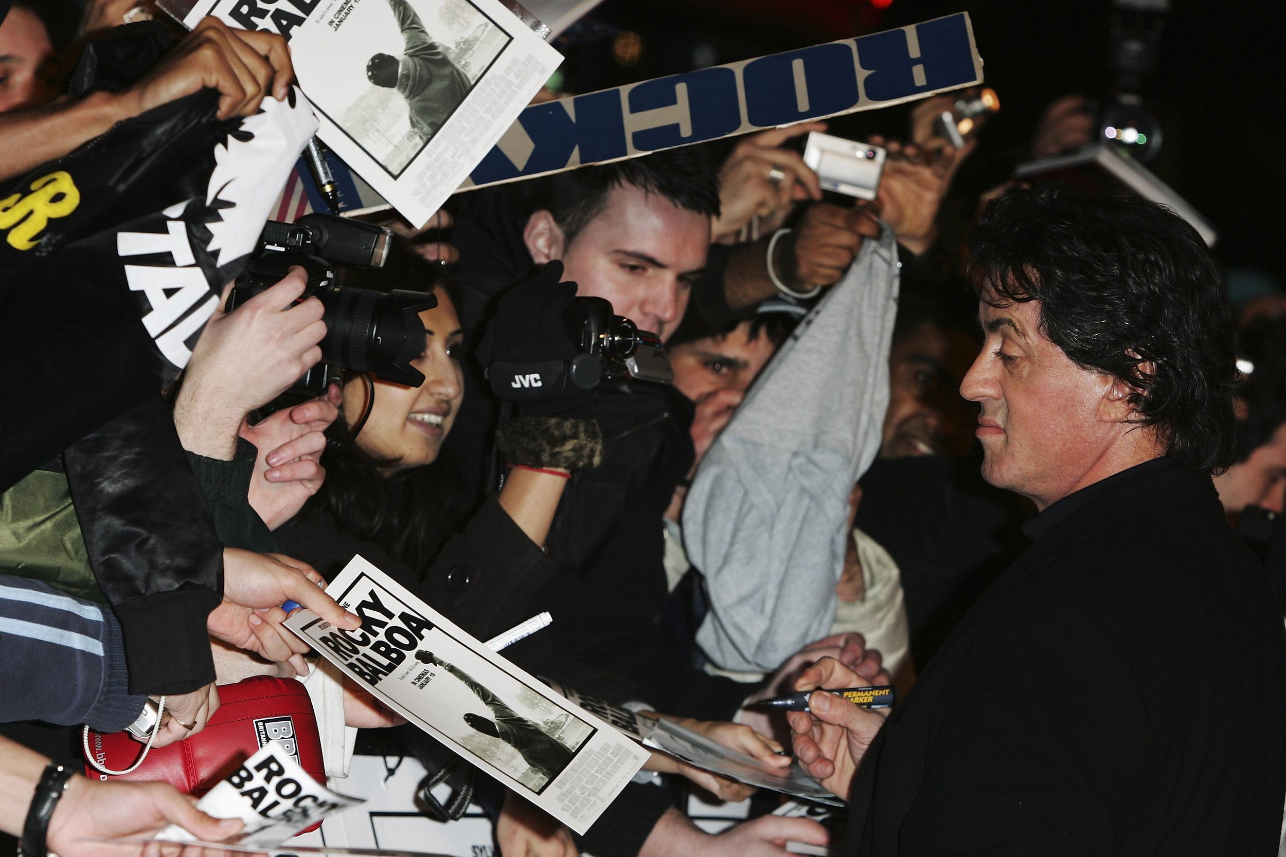 sylvester stallone signing autographs at uk premier