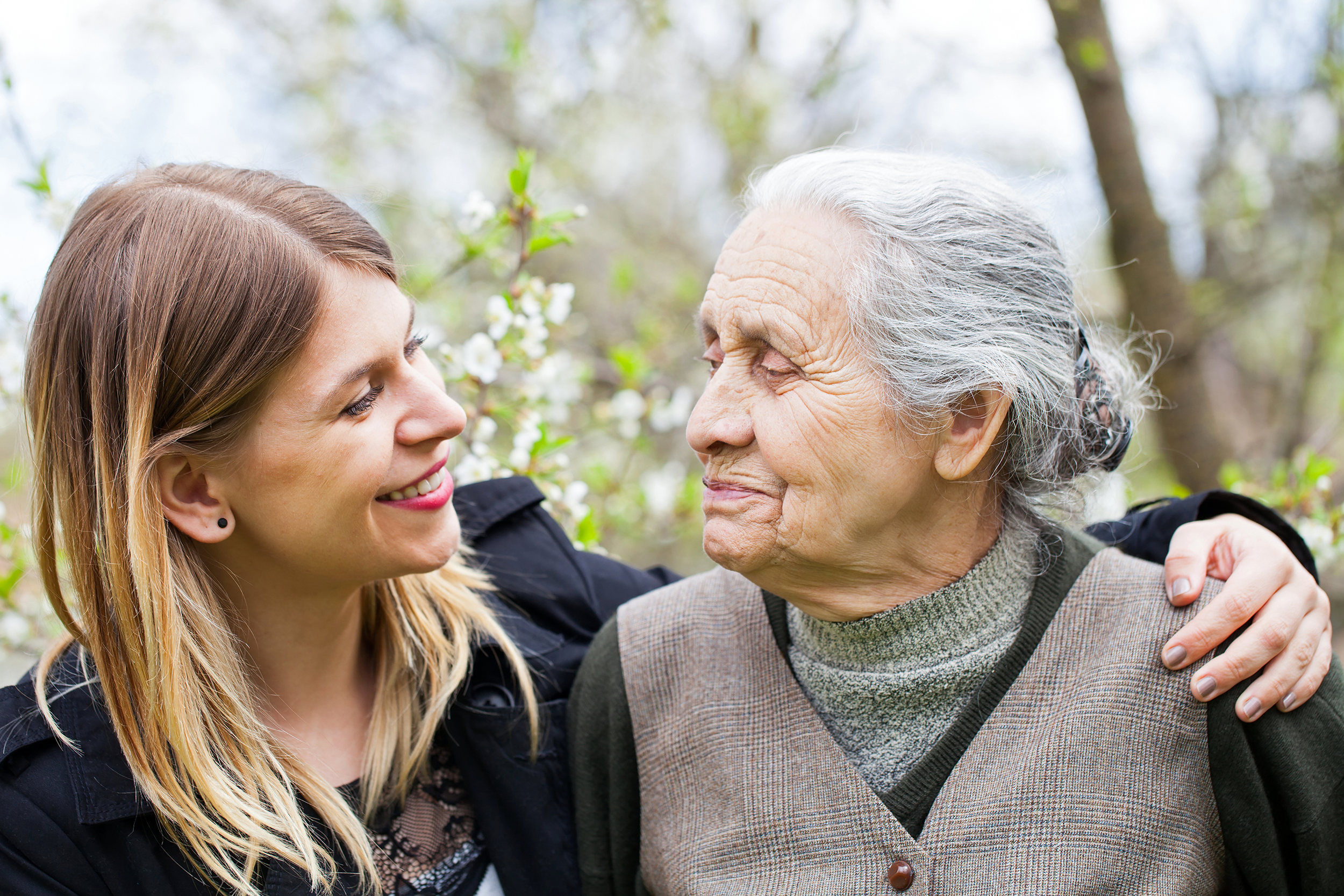 Young woman listening to an elderly woman