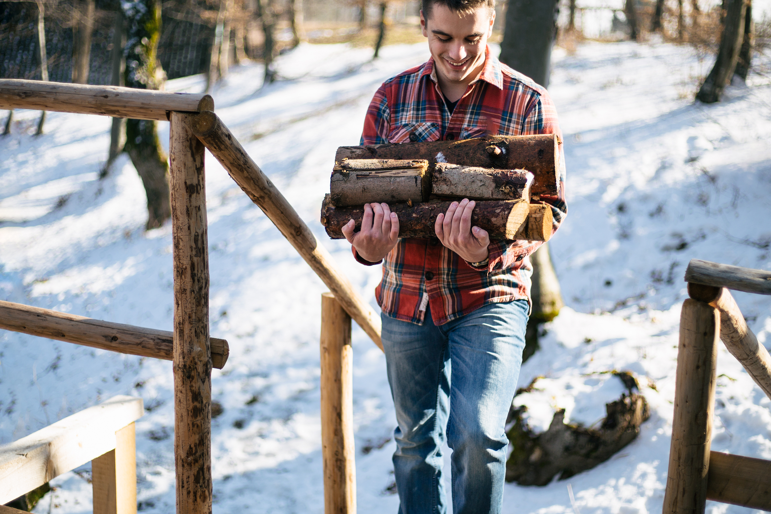 Young man gathering fire wood