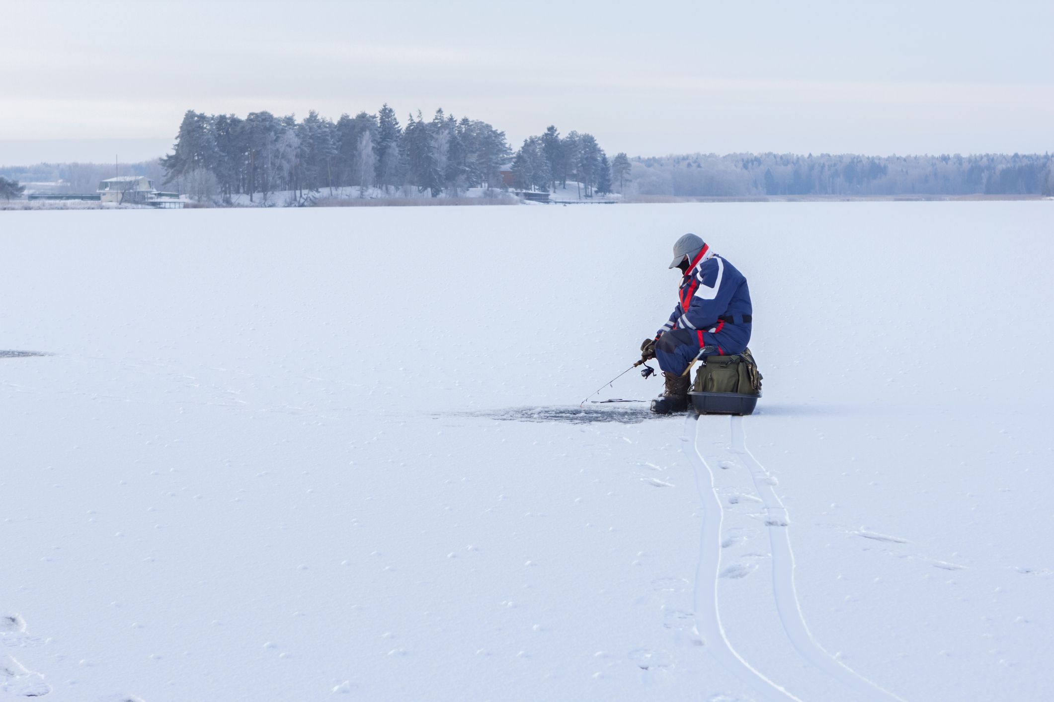 person ice fishing