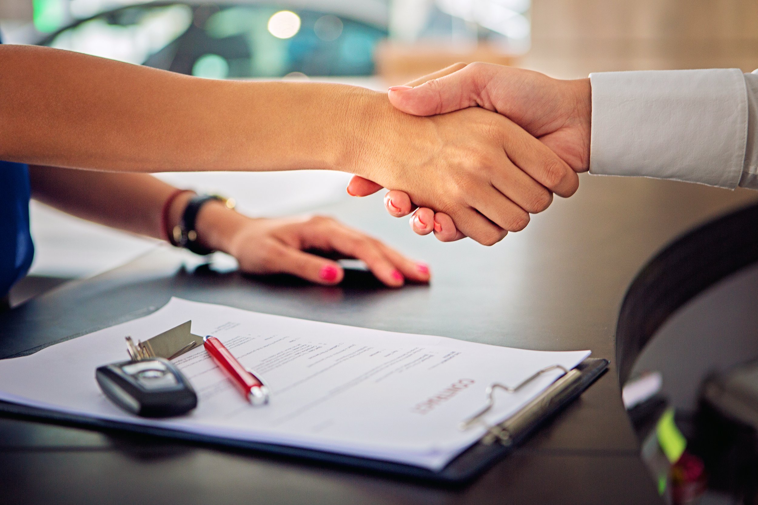 Hands shaking at car rental business