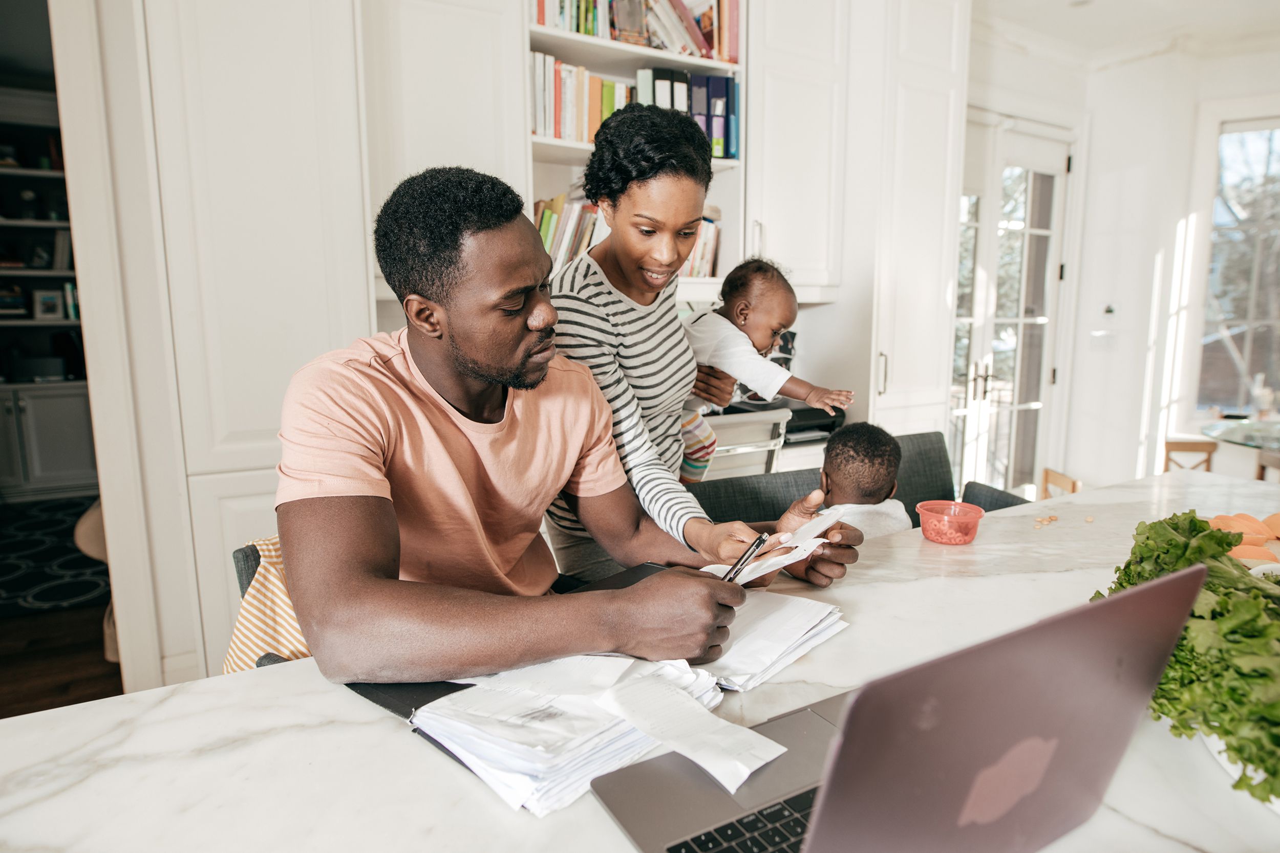 family at home on the kitchen doing expenses