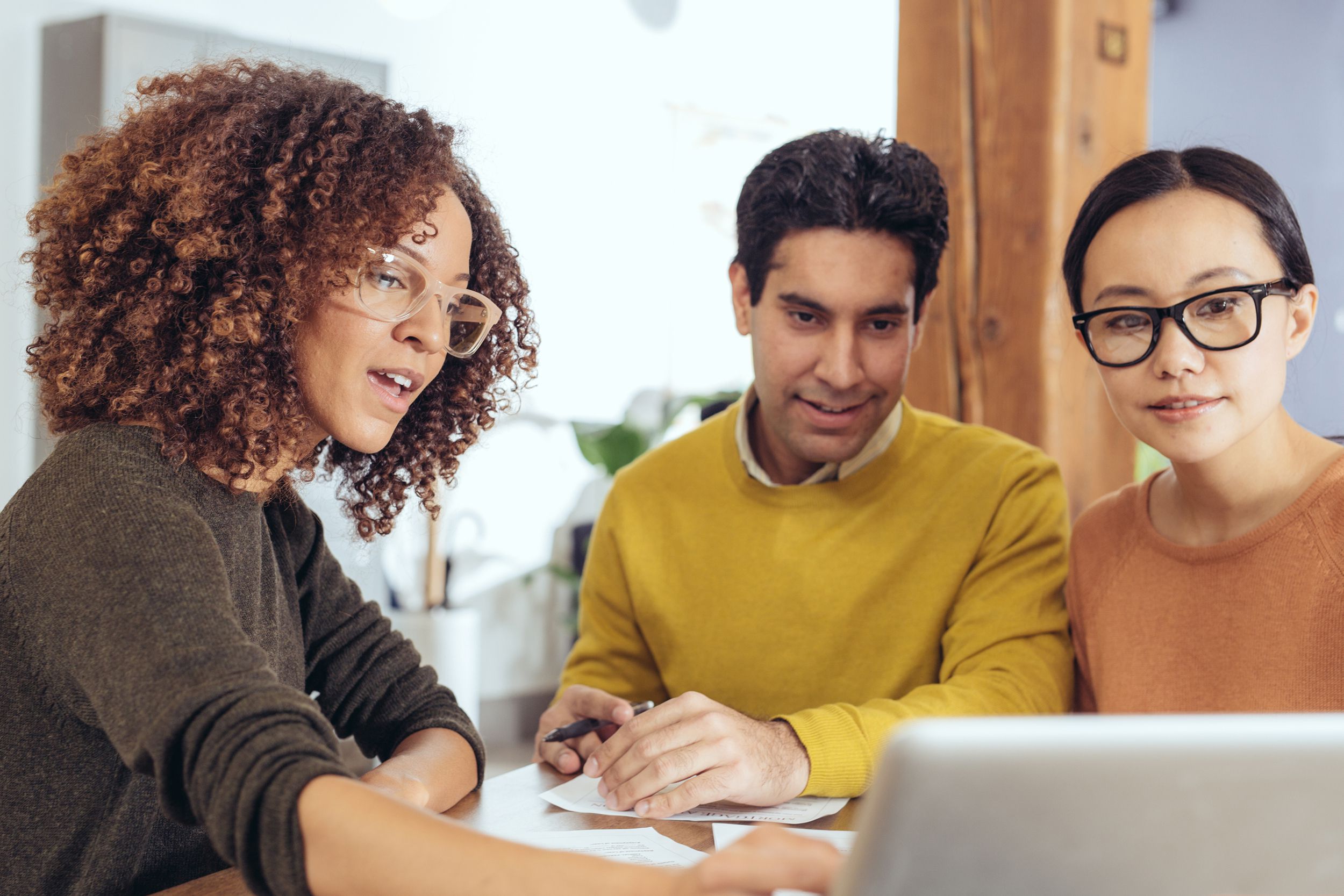 agent going over insurance with couple at office