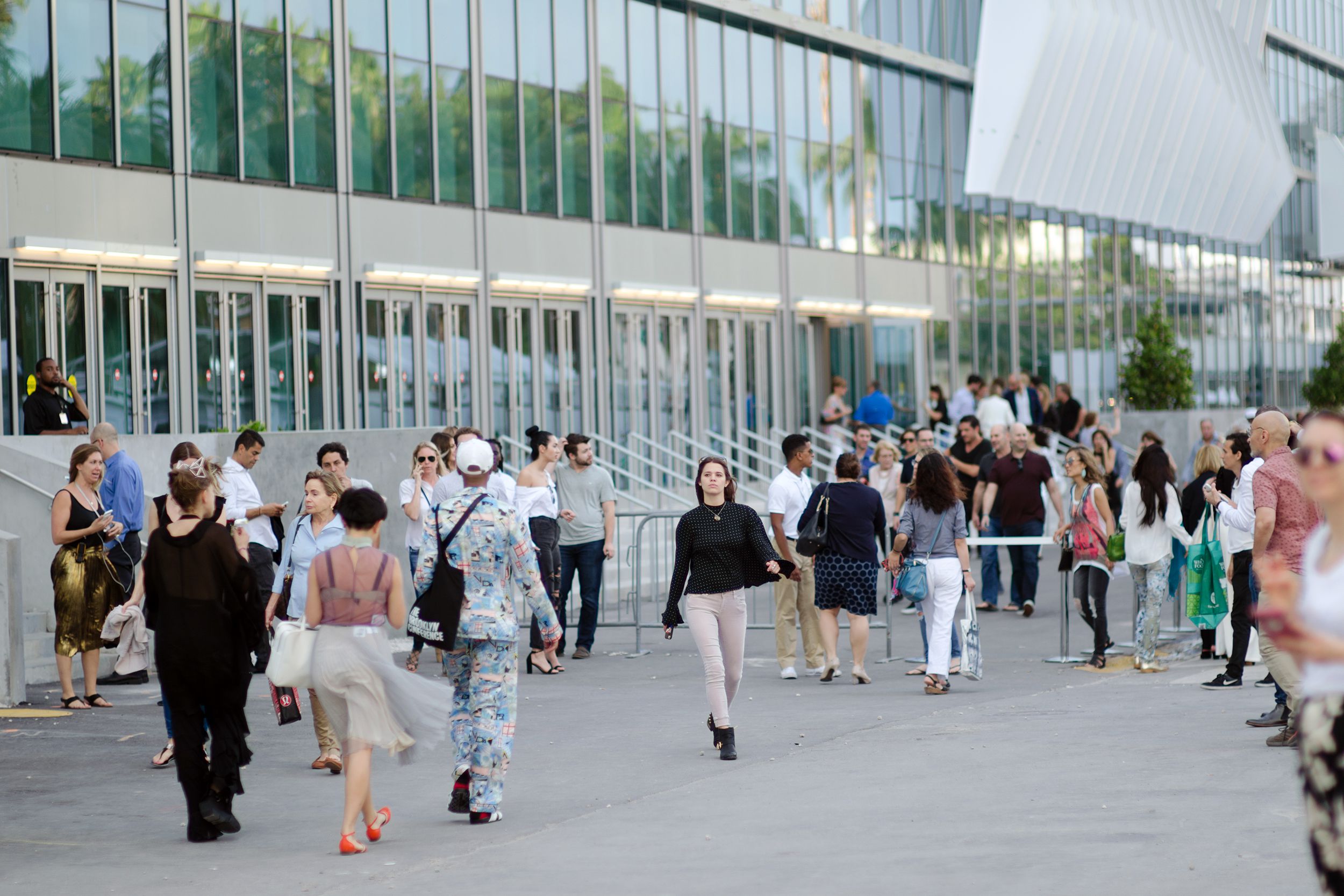 fashionable visitors outside Art Basel in Miami