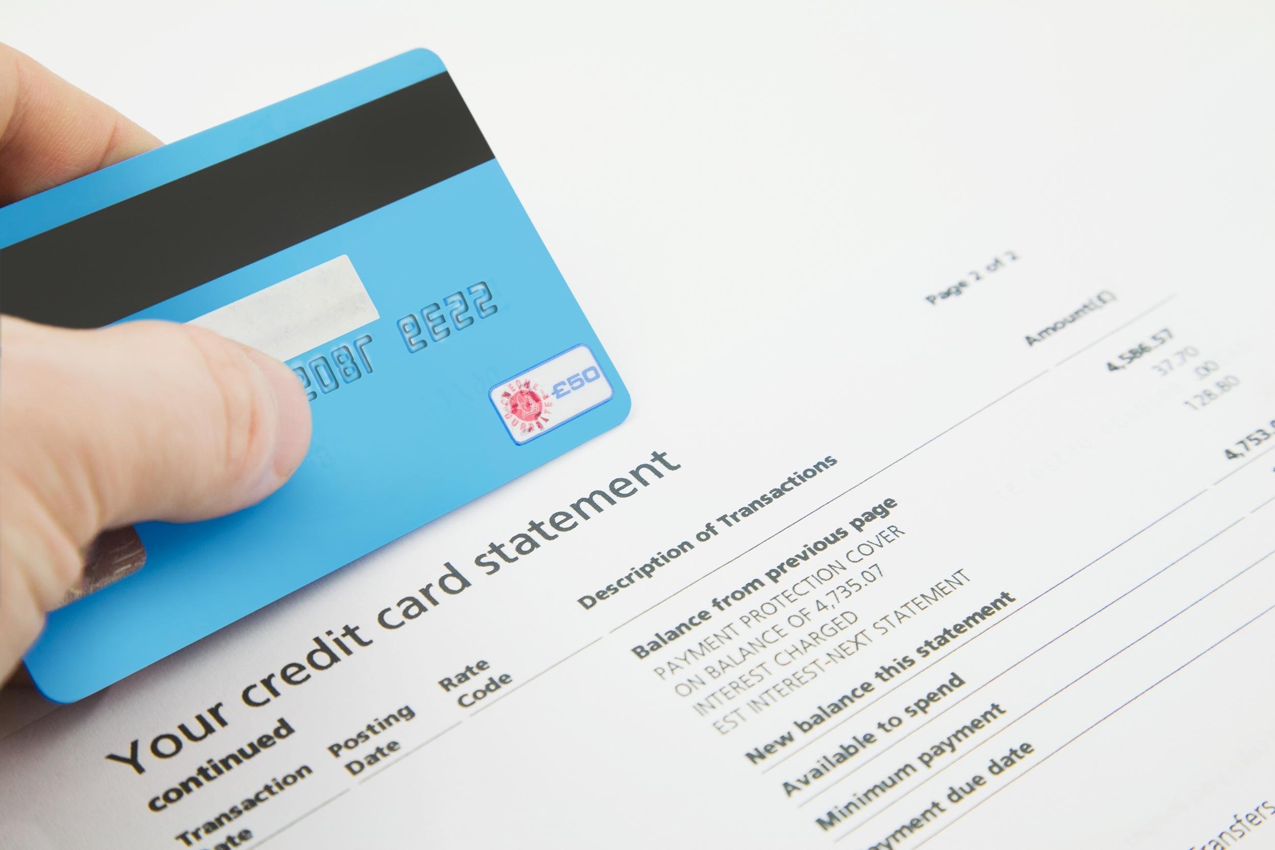 credit card on top of a bank statement