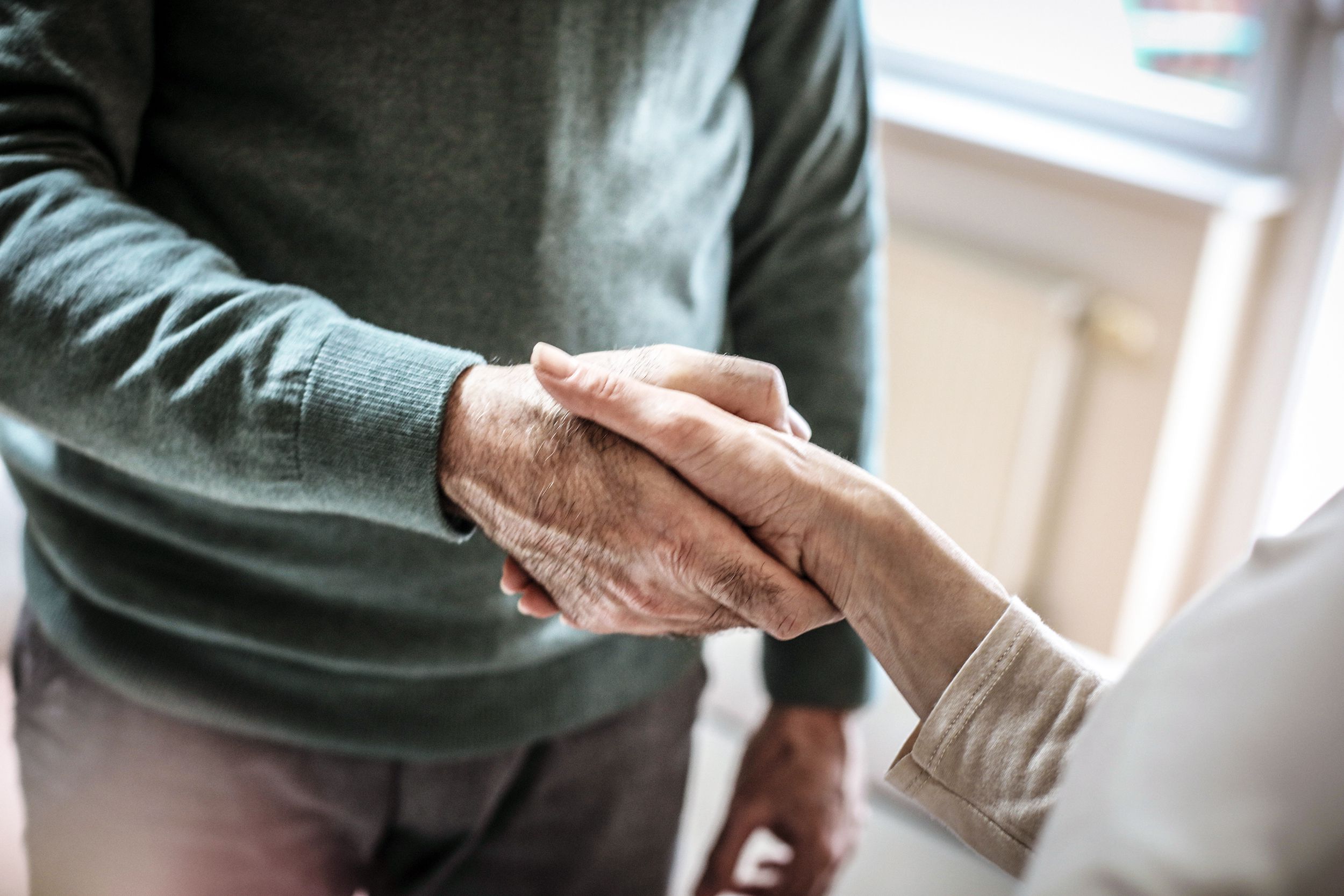 Senior hand shake