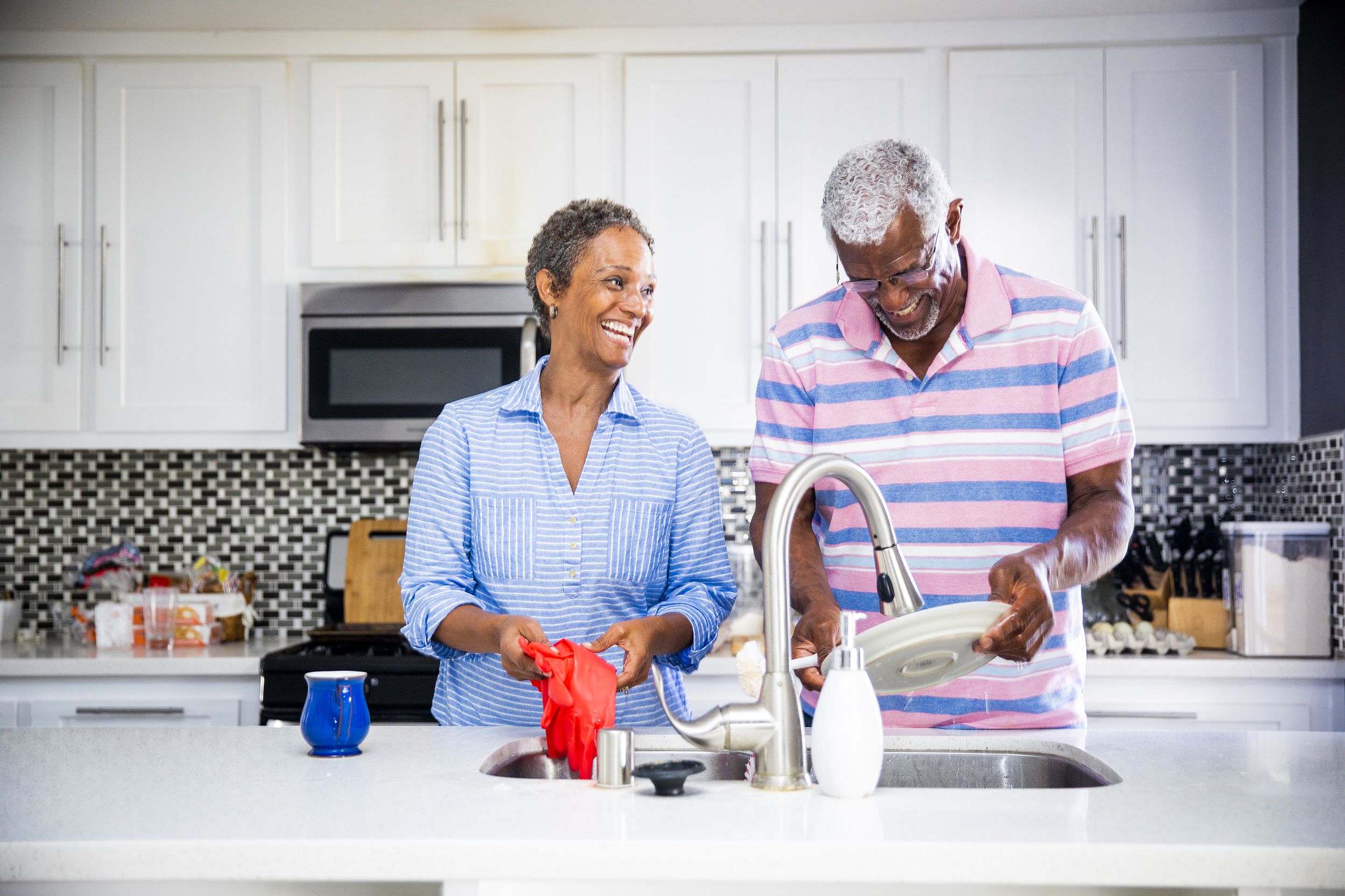 Senior couple doing dishes