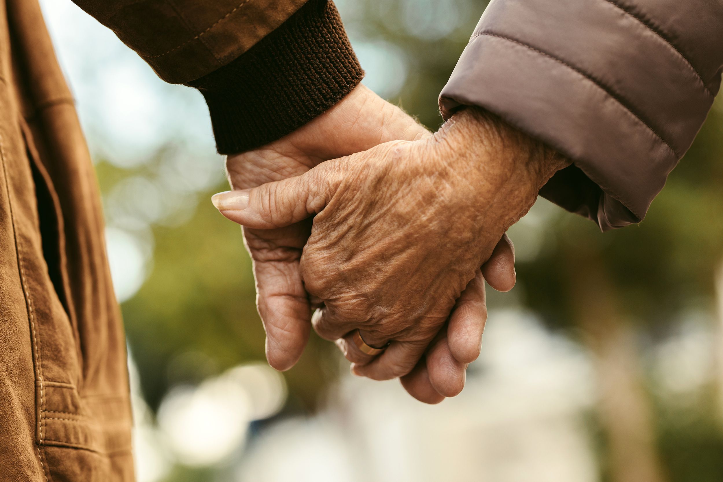 Closeup of seniors holding hands