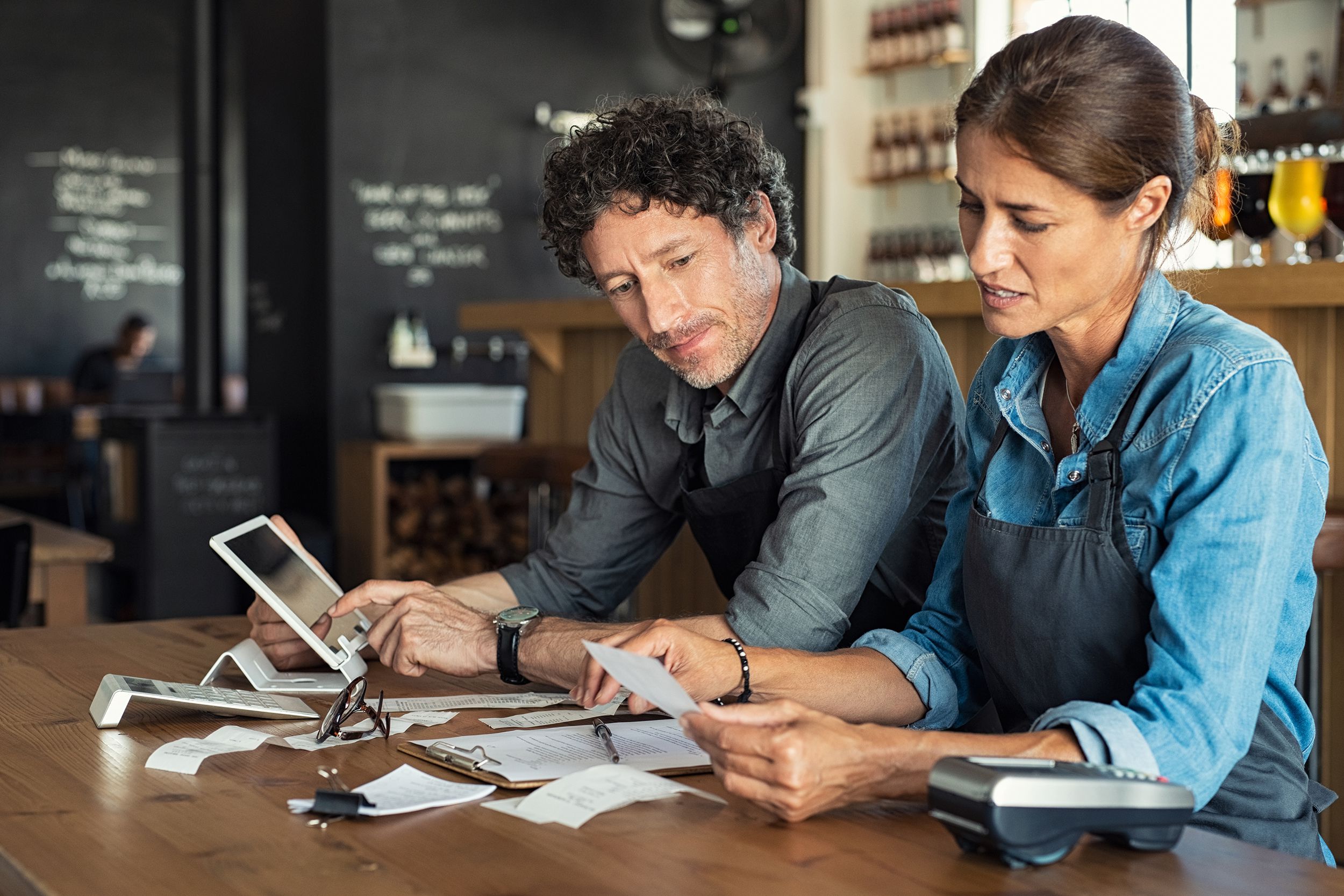 staff calculating restaurant bill at end of day