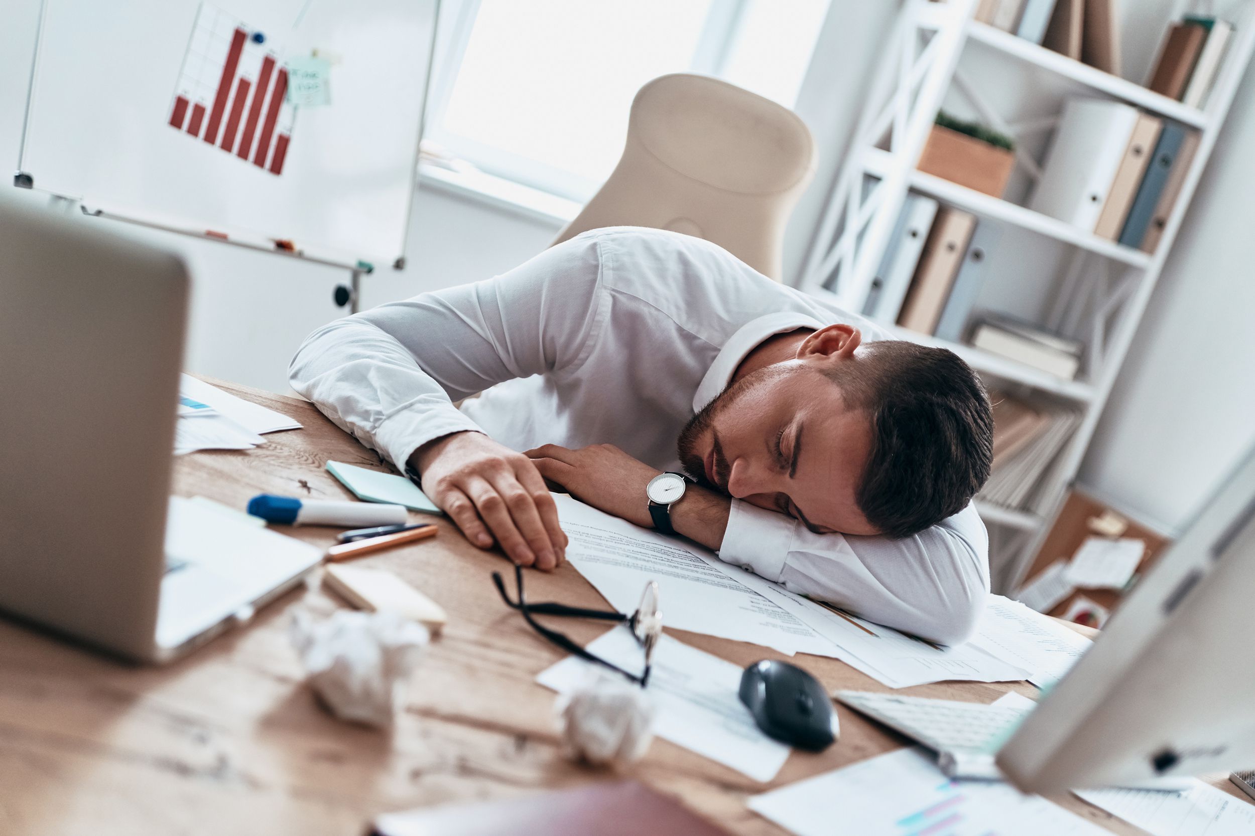 man asleep at office