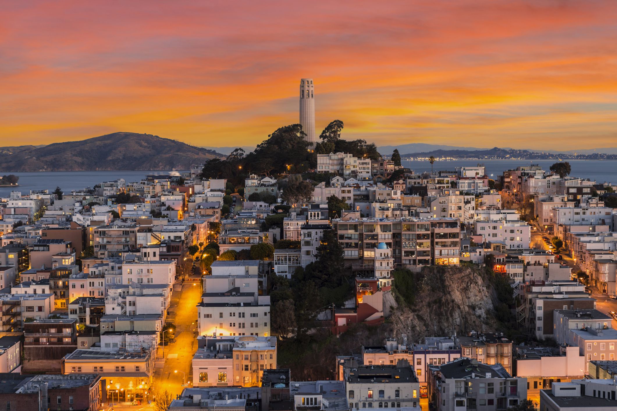 View of Coit tower with sunset sky in downtown San Francisco