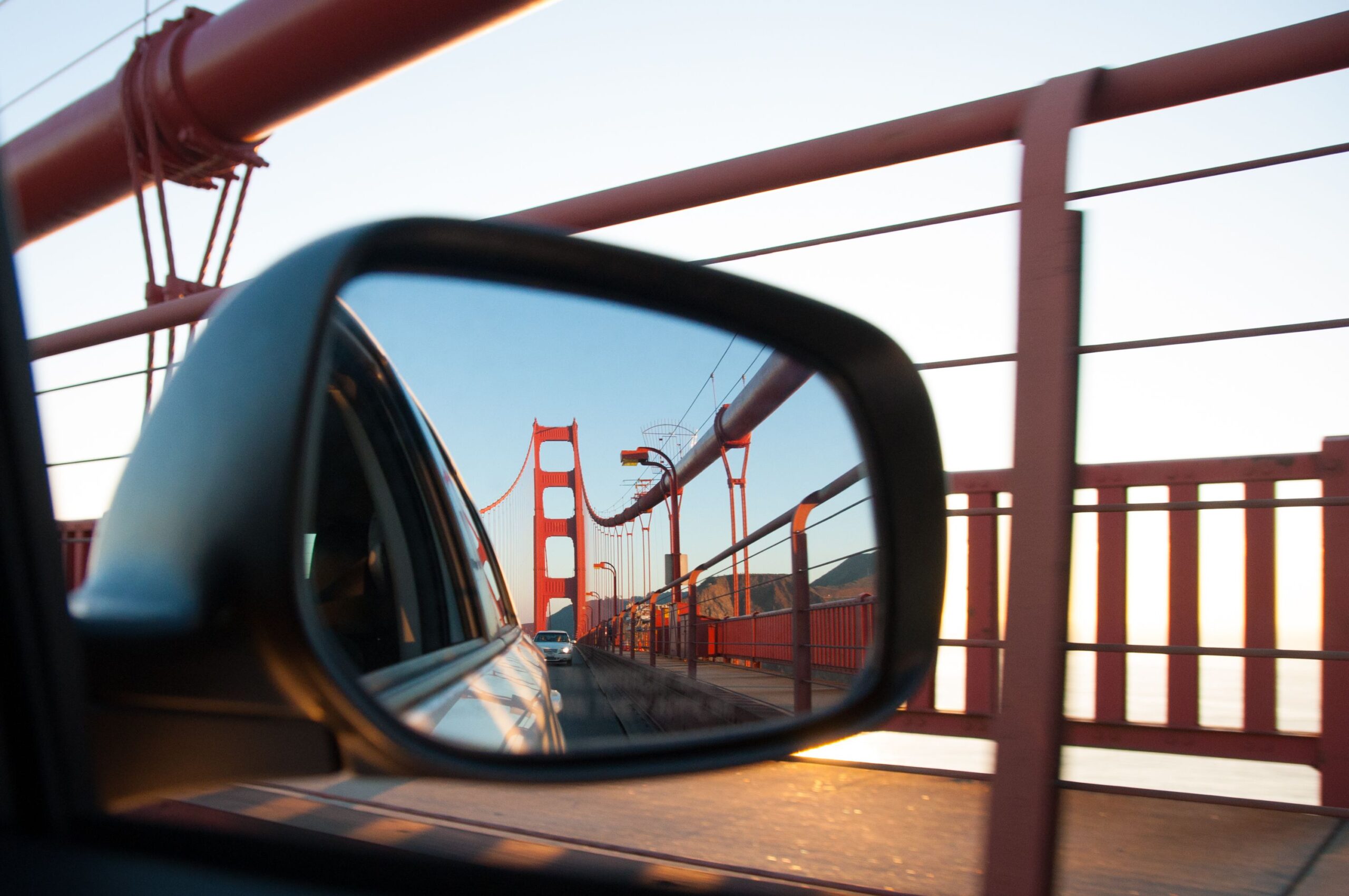 Looking at golden gate bridge in rear view mirror