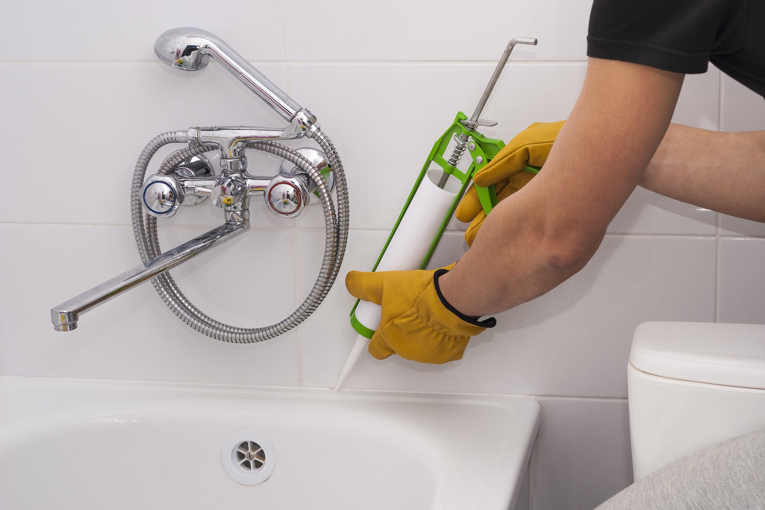 man cocking bathtub in bathroom