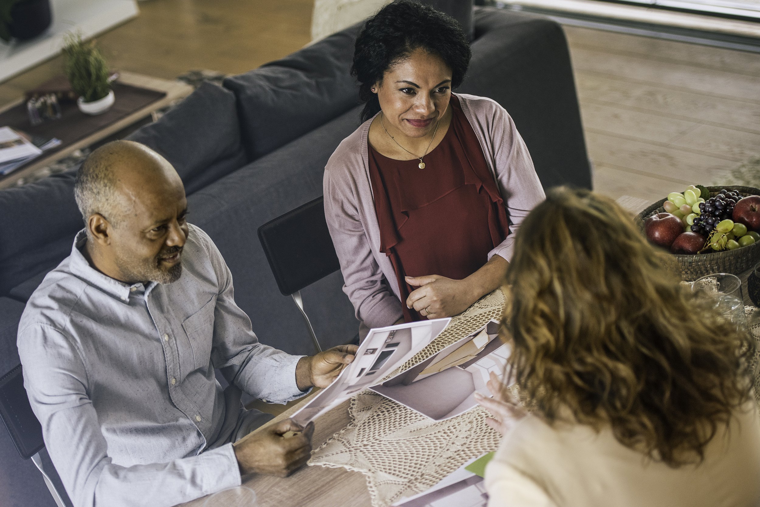 interior designer with multi-ethnic couple