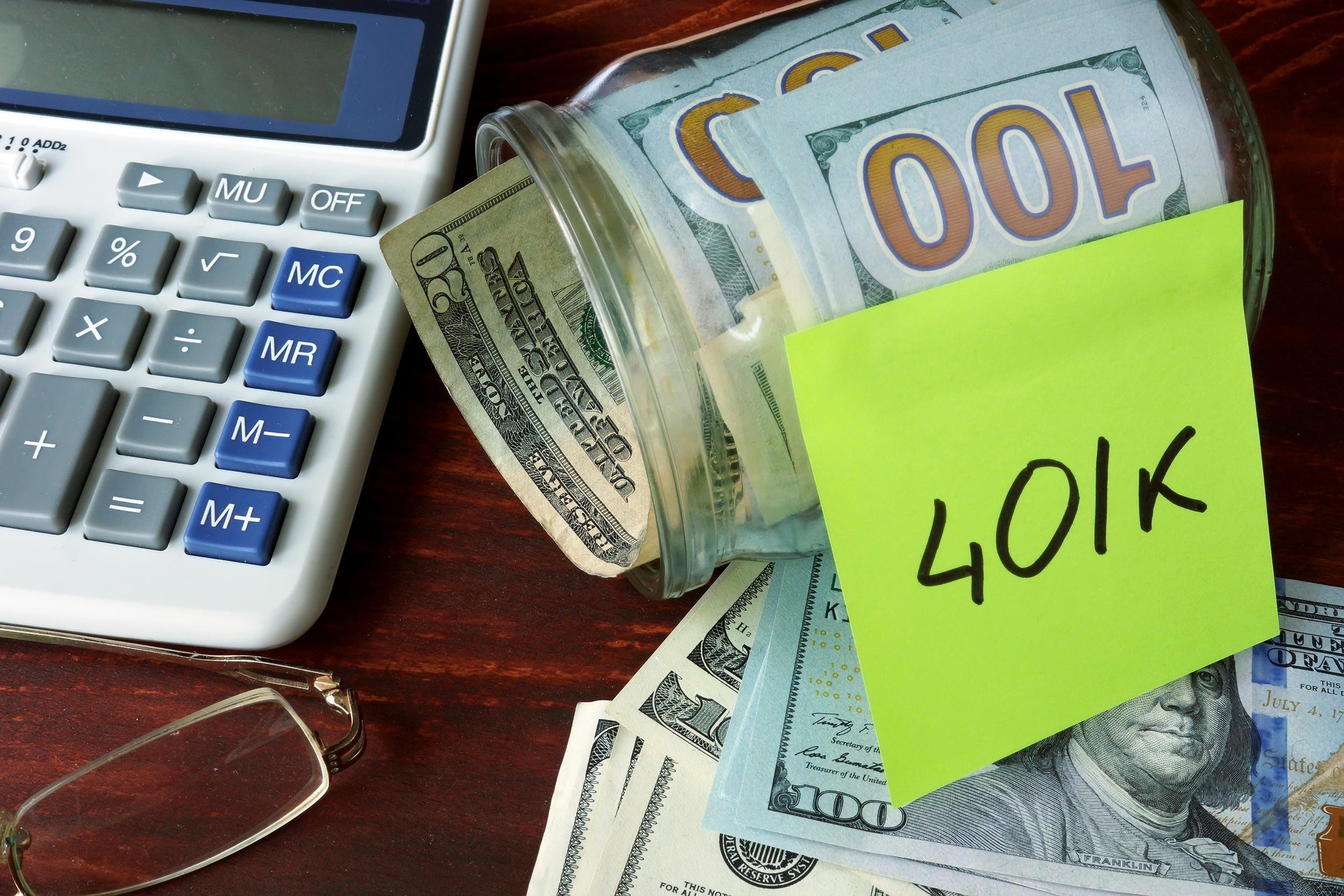 jar with label 401k and money on the table