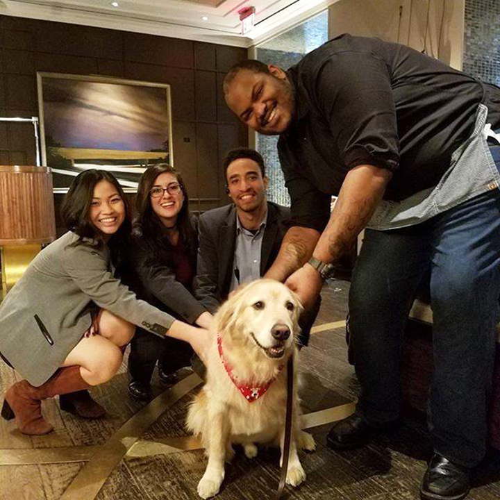 Kimpton hotel employees with a dog