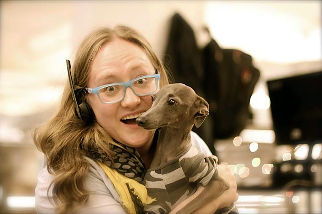 Woman hugging dog at a Rover office