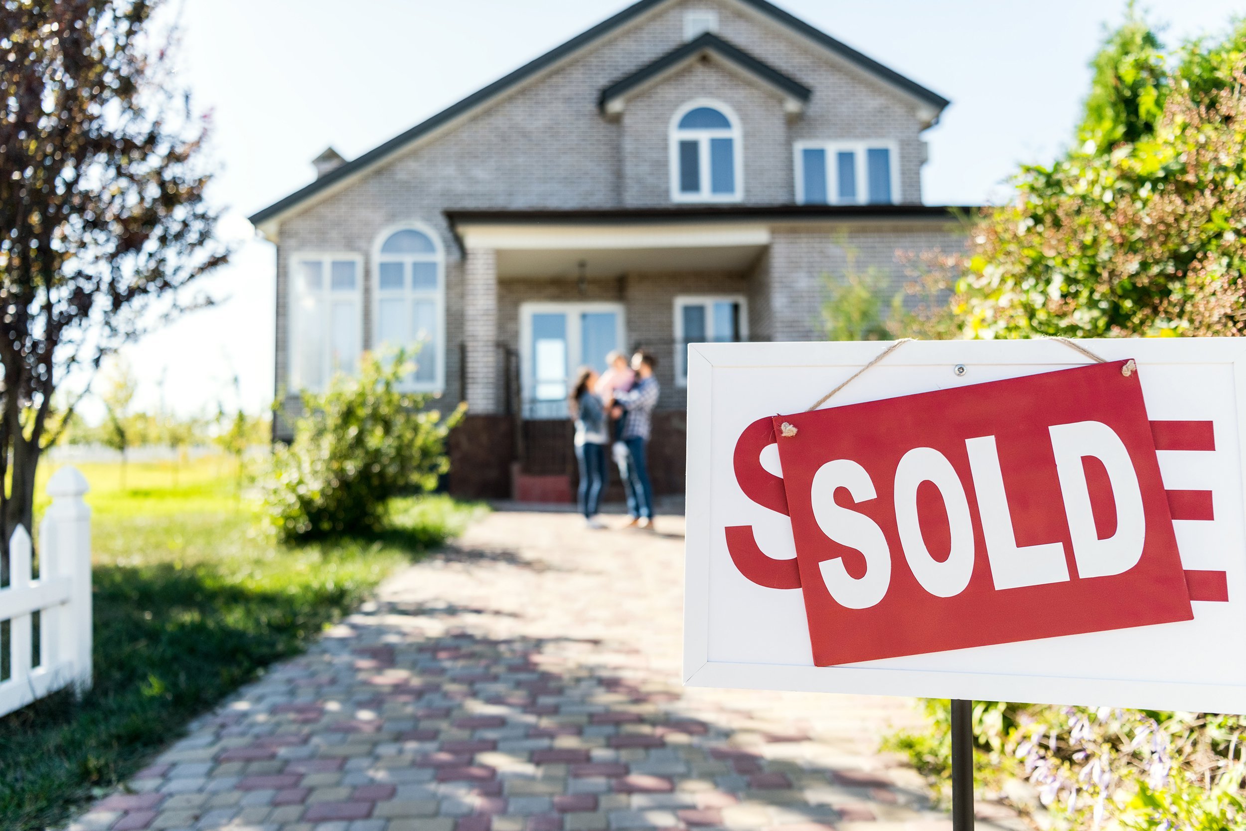 Sold sign in front of a house