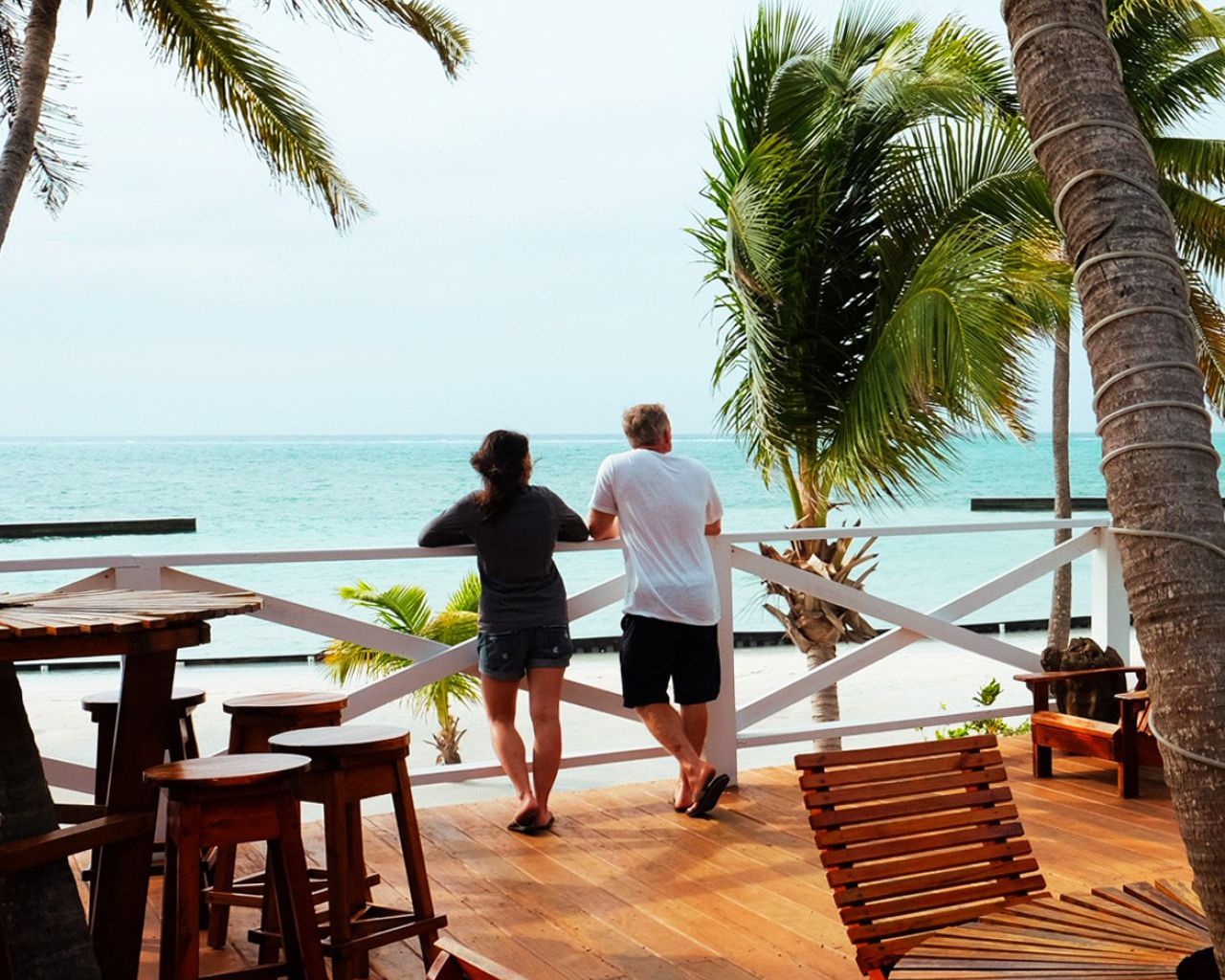 two people looking at ocean at resort
