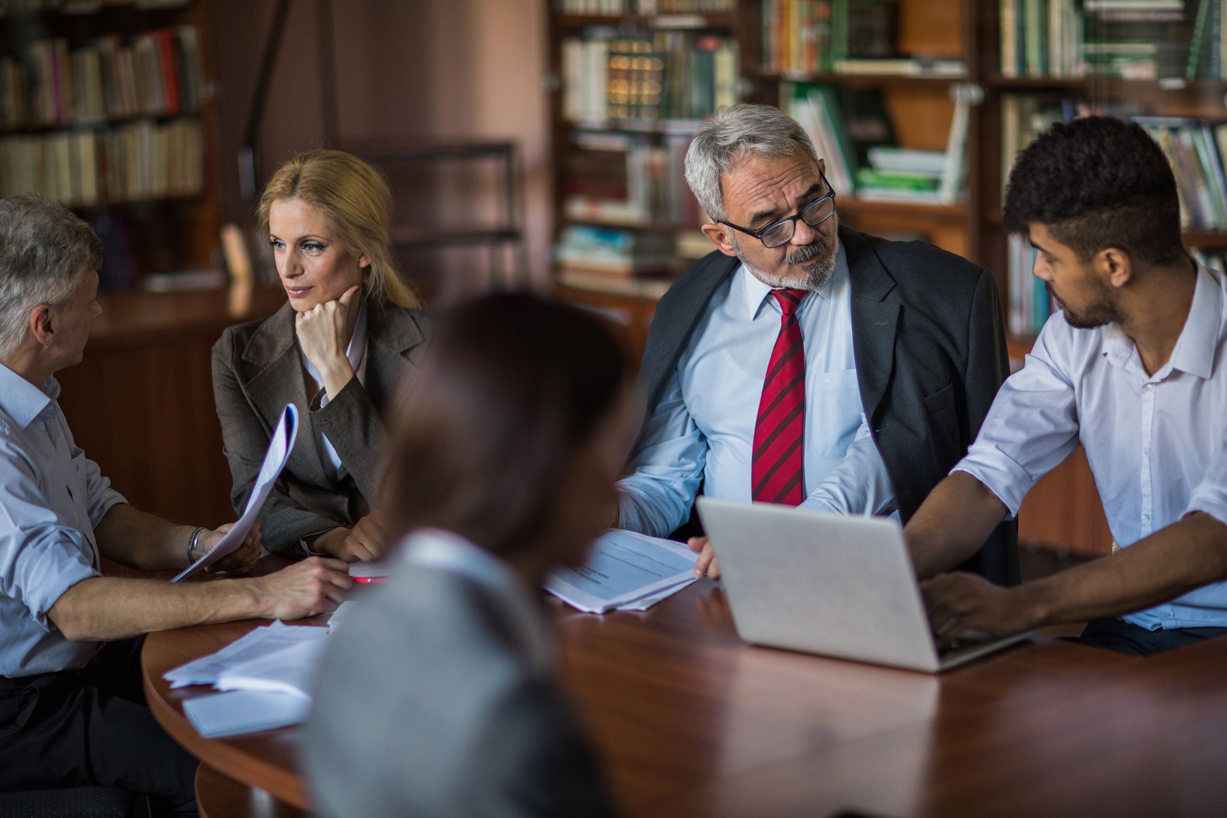 team of business colleagues talking on a meeting in the office