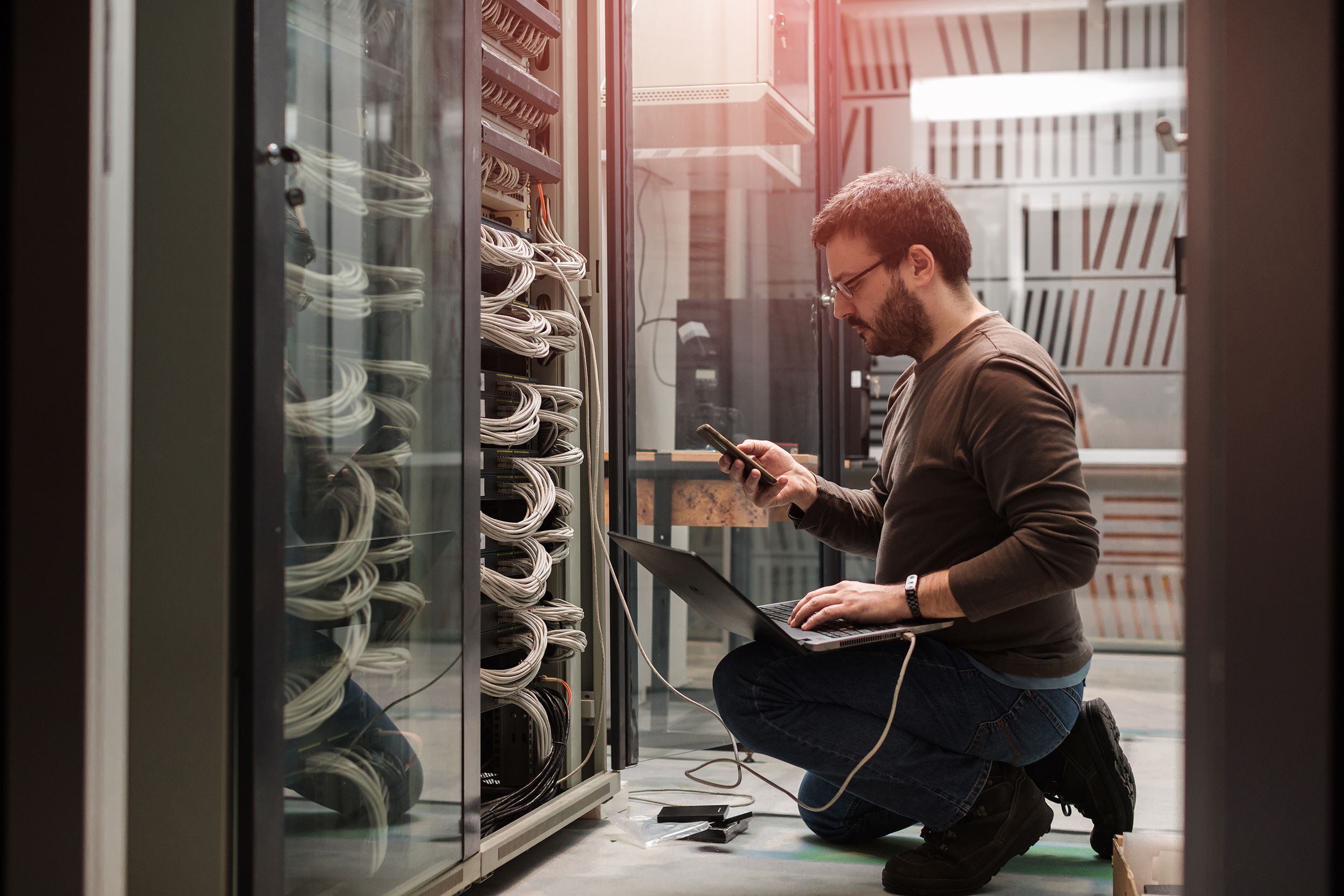 engineer in servers room working