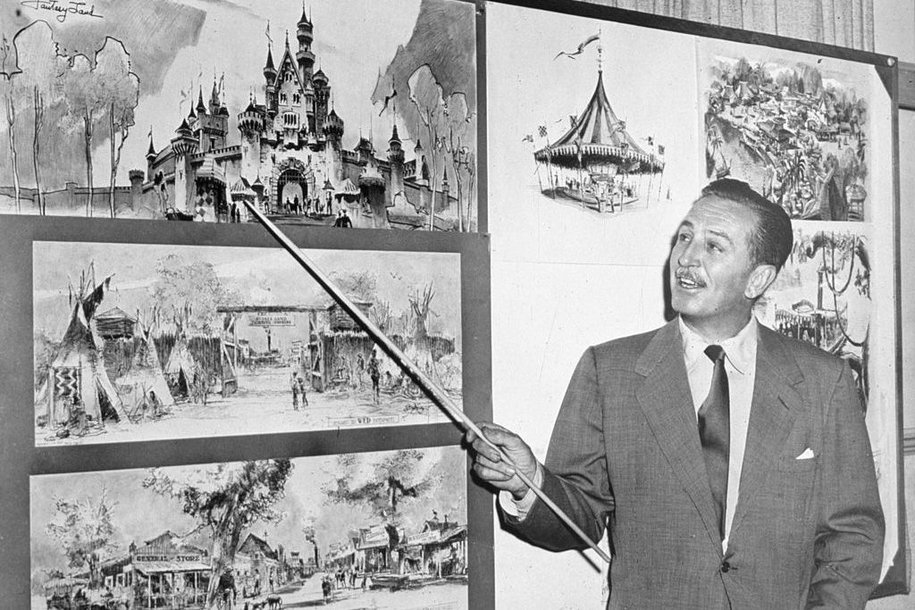 walt disney gesturing at designs for parks