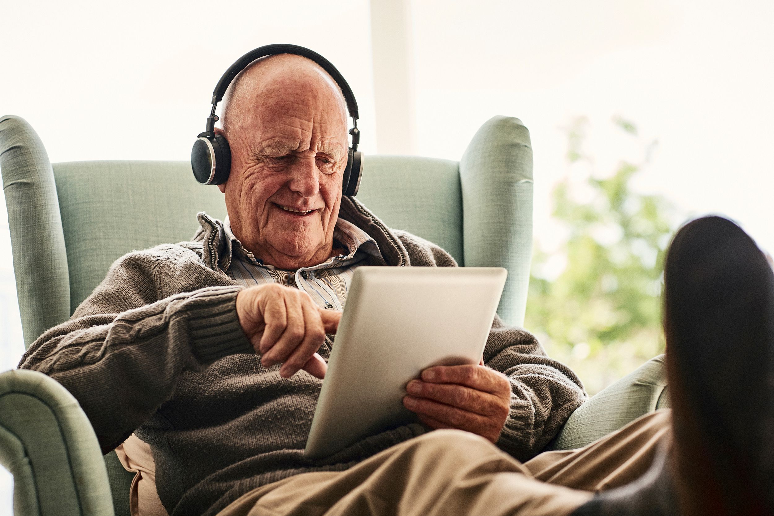 Senior man looking at a tablet