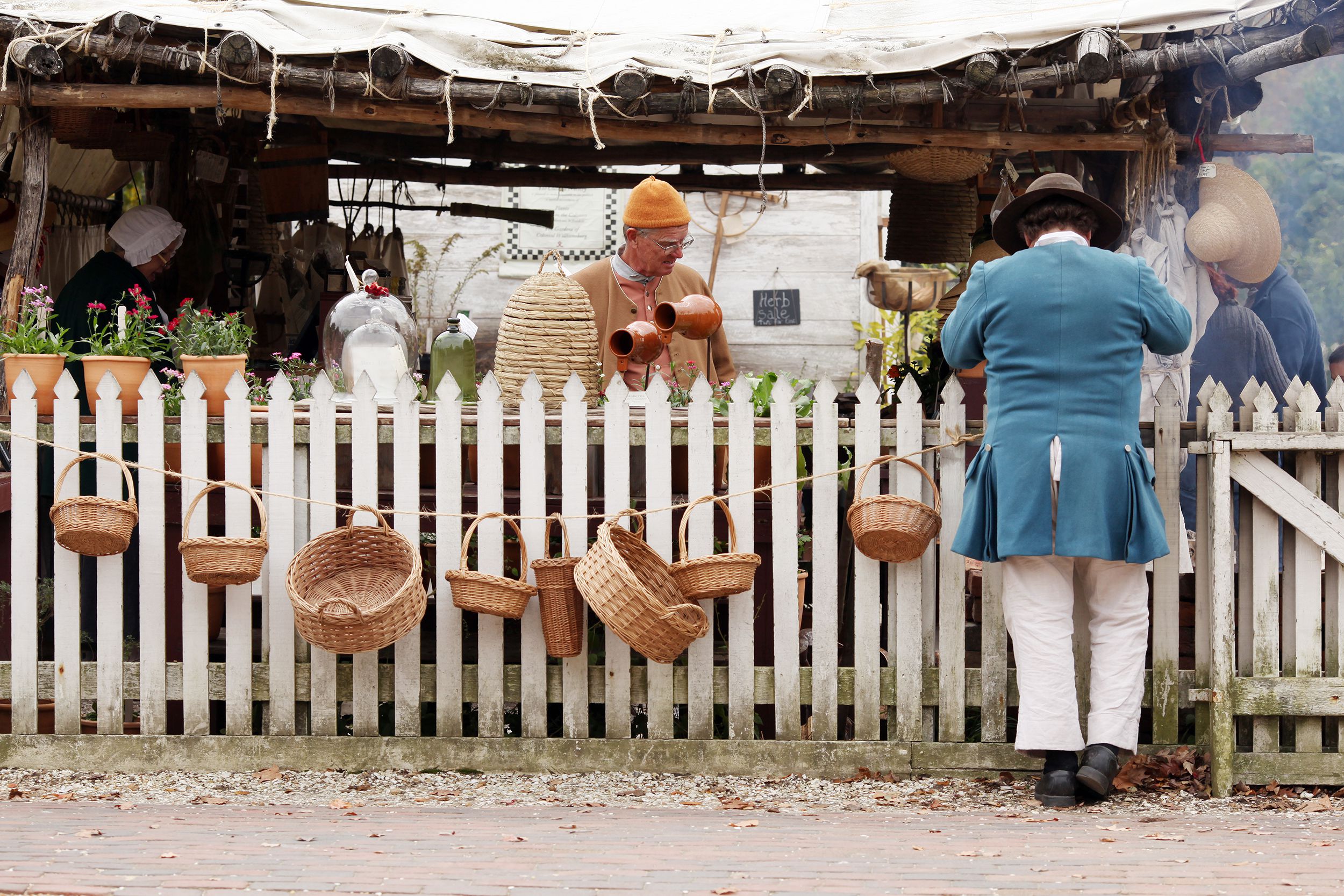 colonial scene from Williamsburg of actors recreating a scene out of colonial times