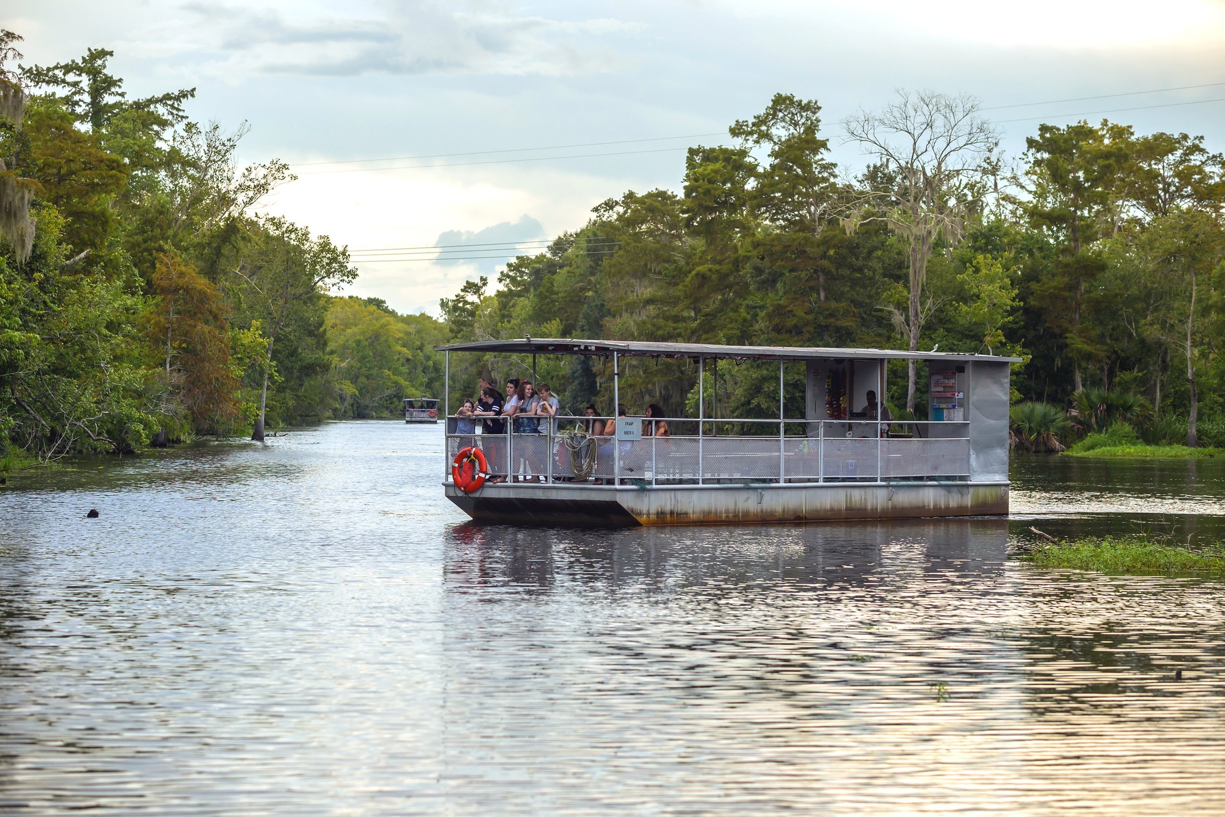 Tourist on a boat for swamp tour in New Orleans Louisiana.