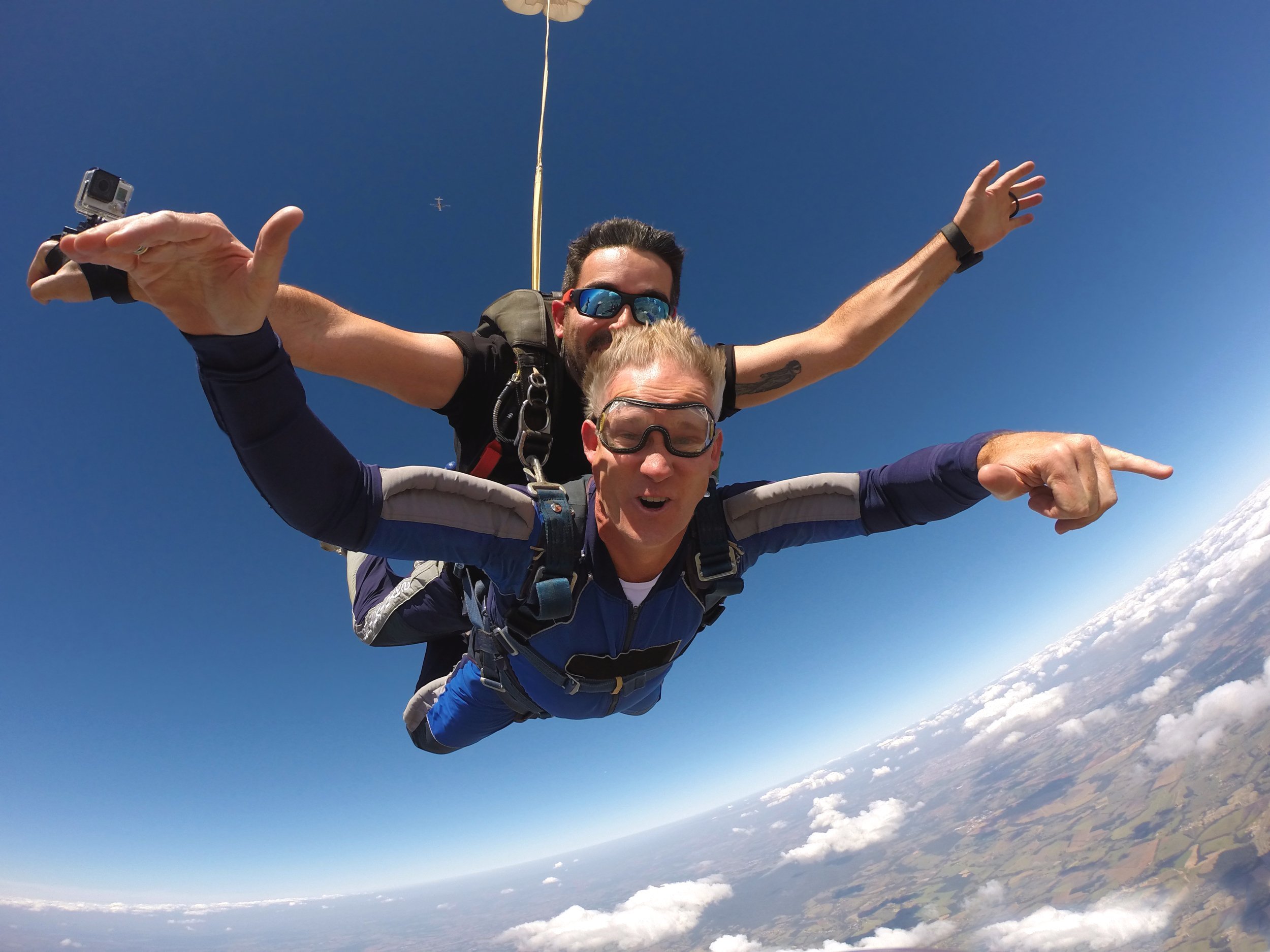 Older man tandem skydiving.