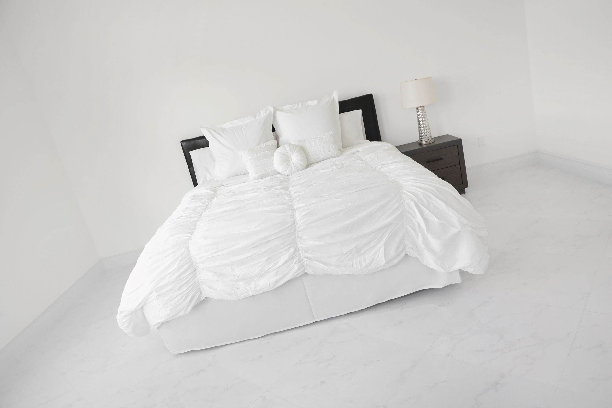 bedding in bag on bed in master bedroom