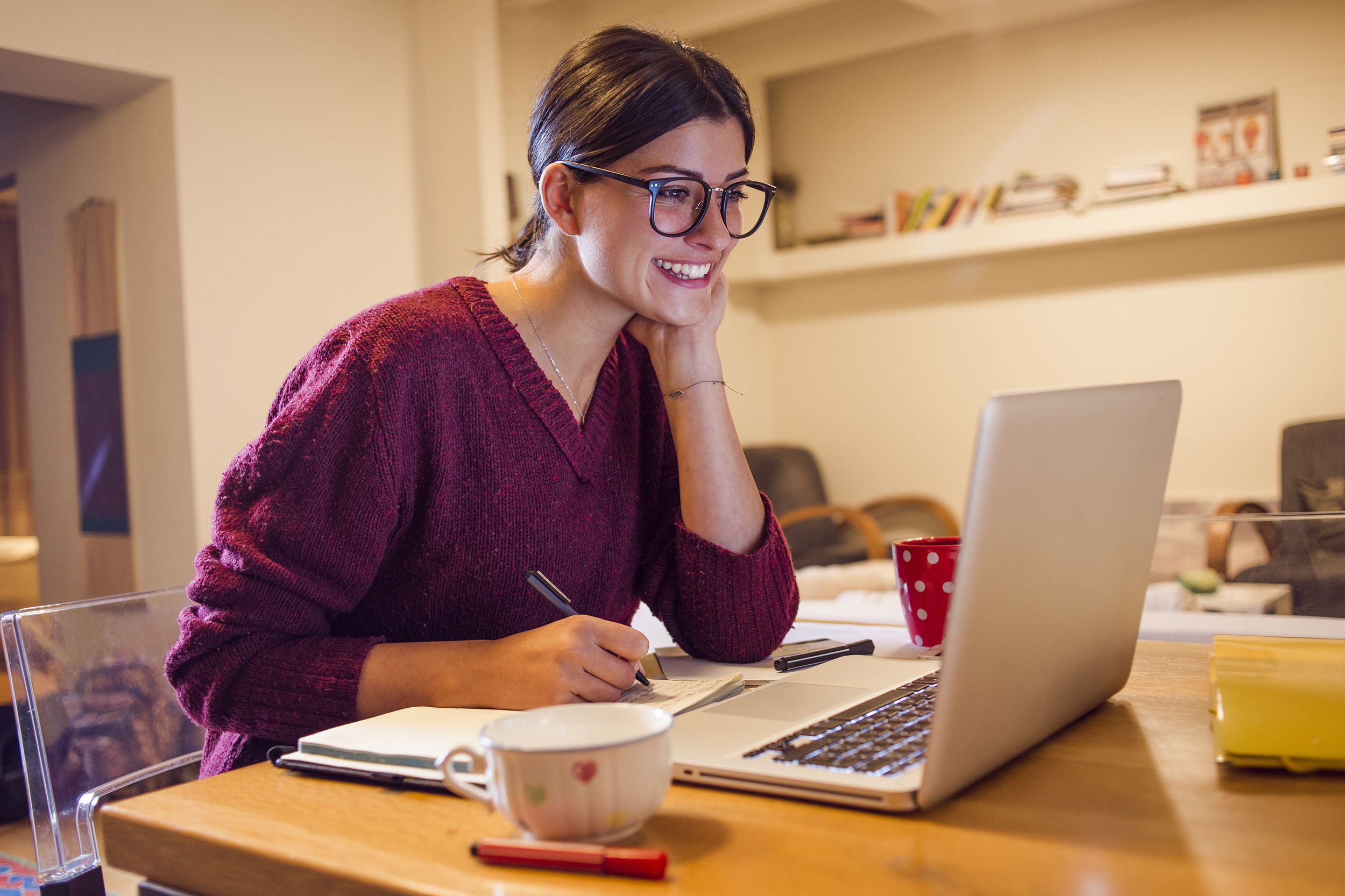 young woman working from home on laptop