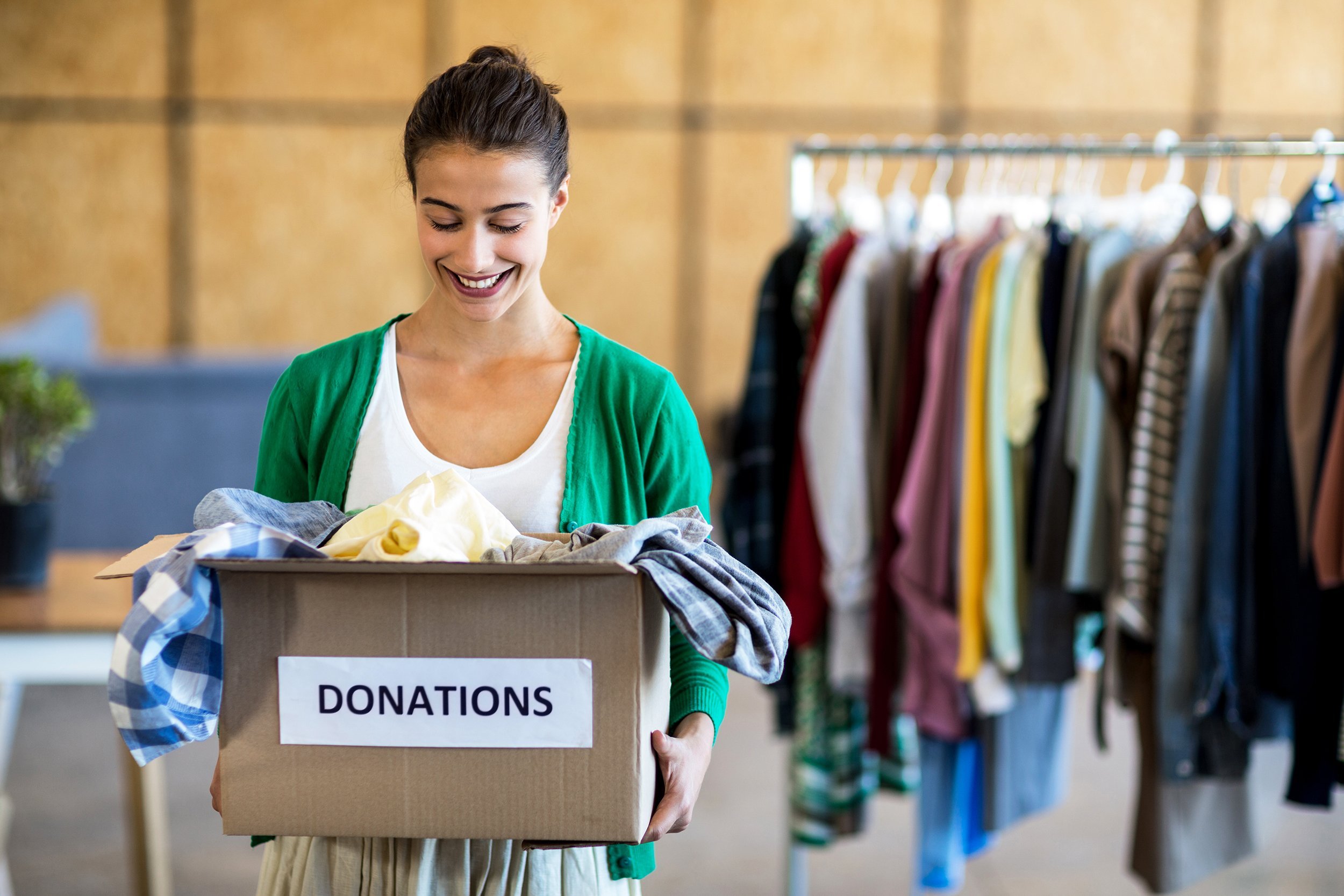 young woman with donation box in the office