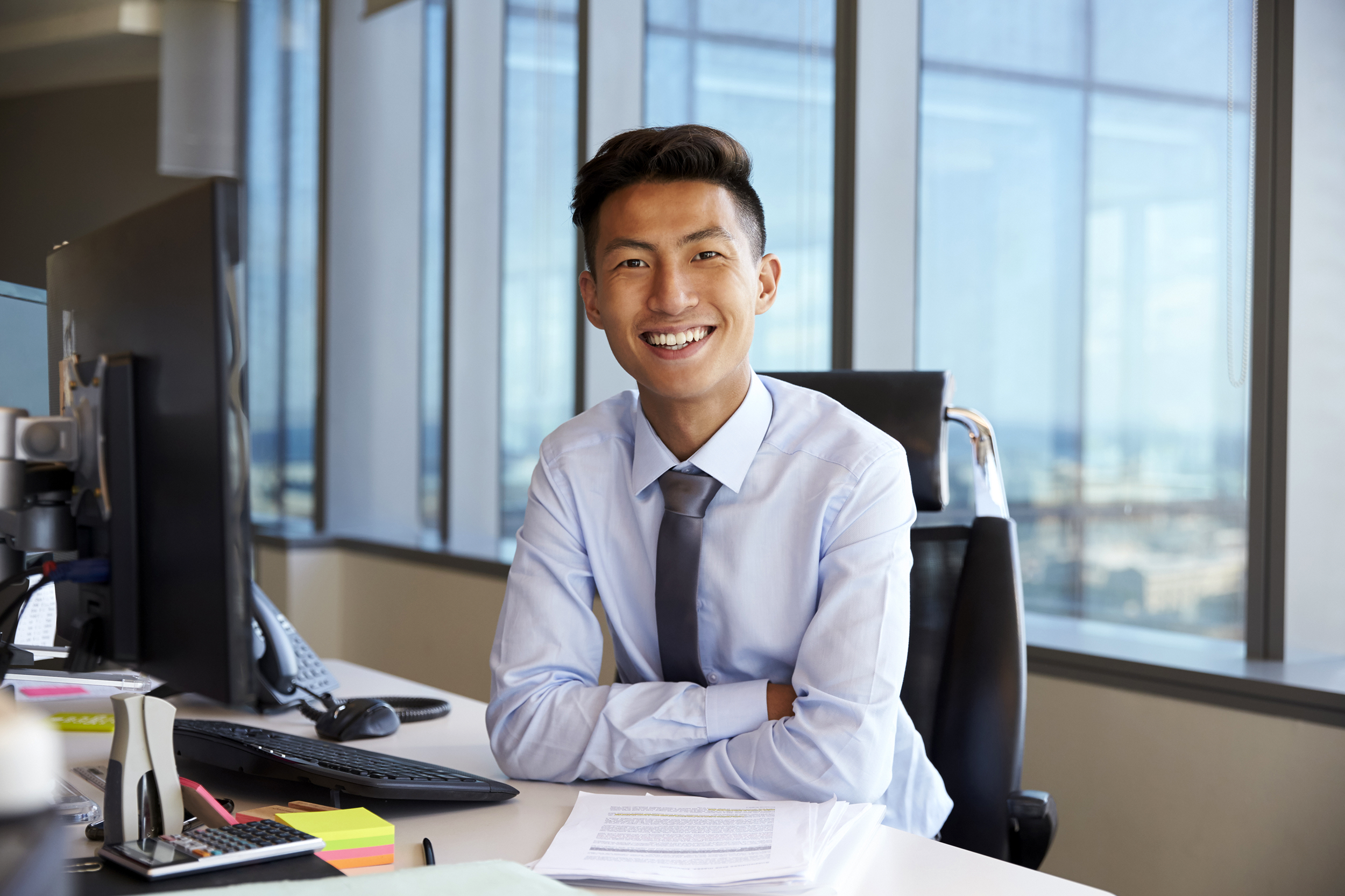 Young man sitting at an office desk