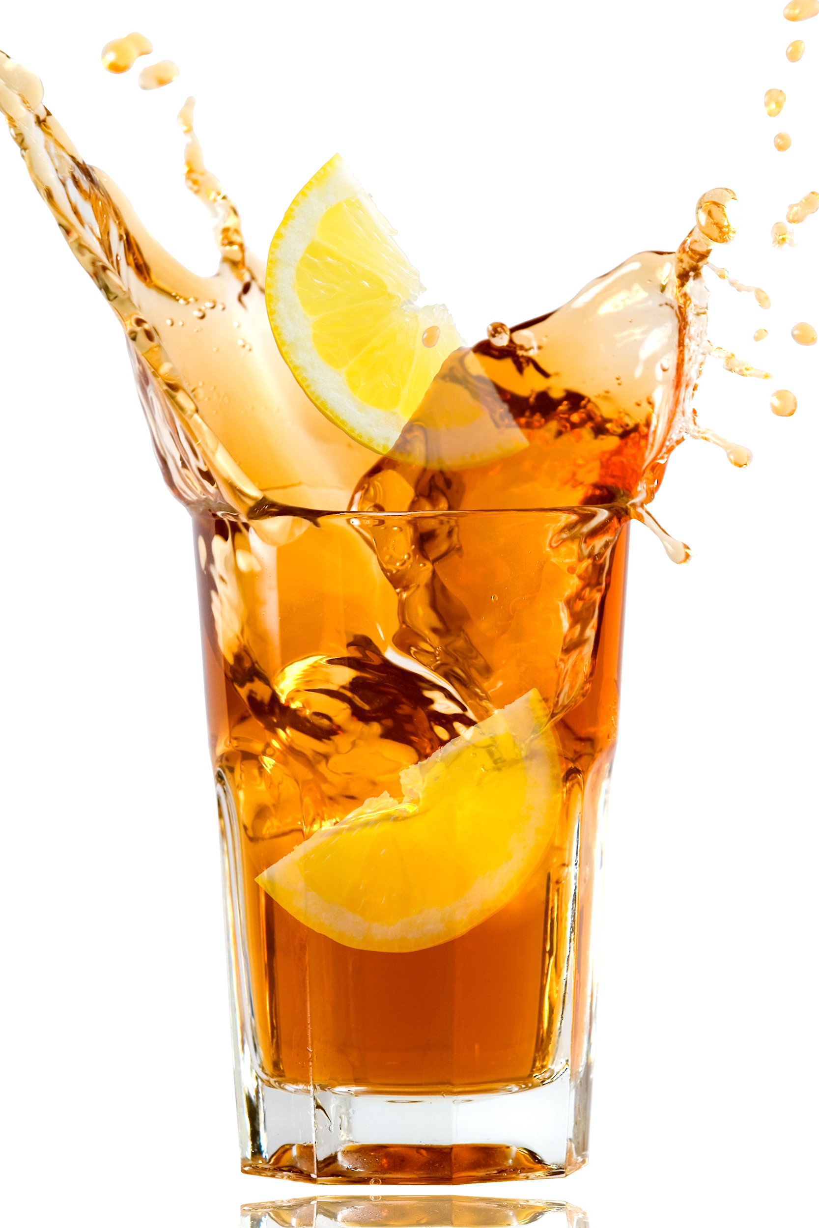 glass full of fresh iced tea with lemon in artistic splash