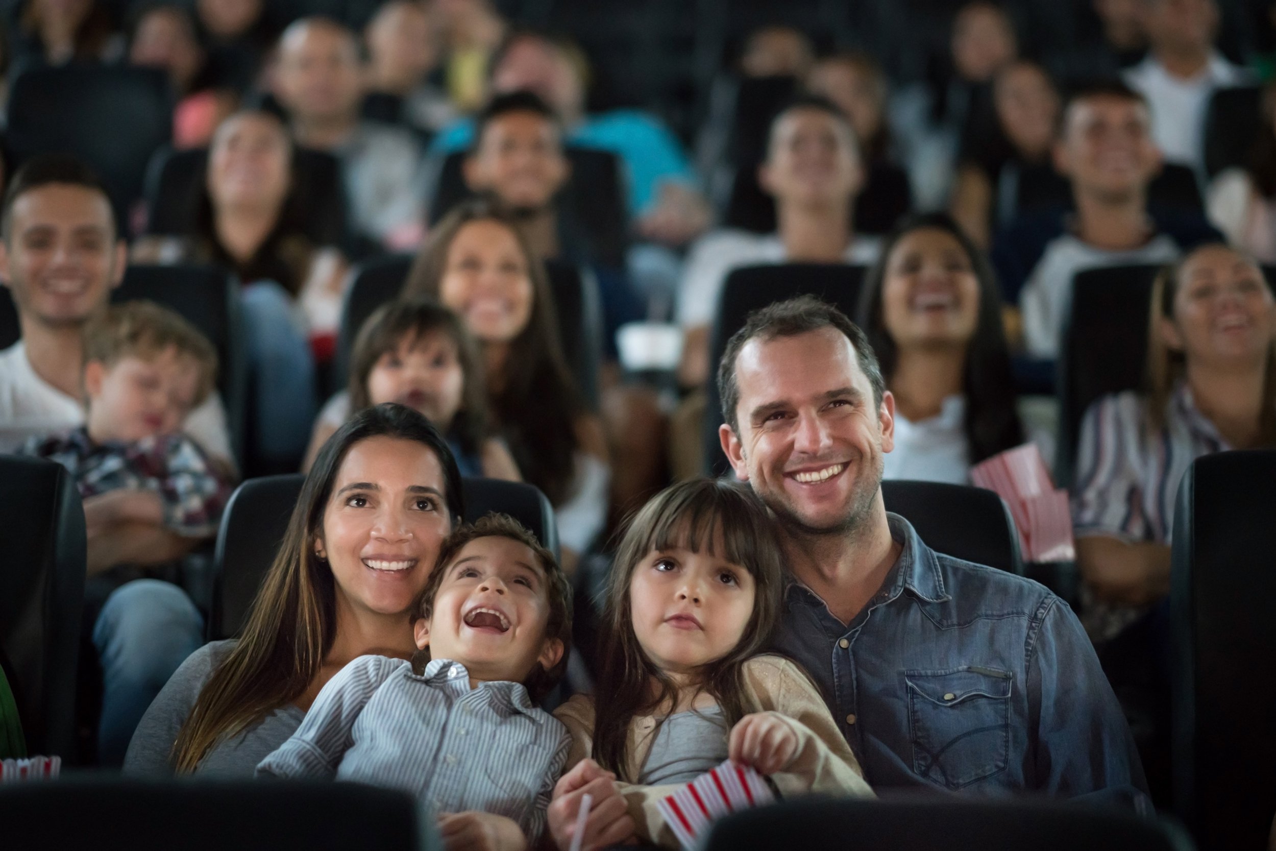 happy family having fun at the cinema
