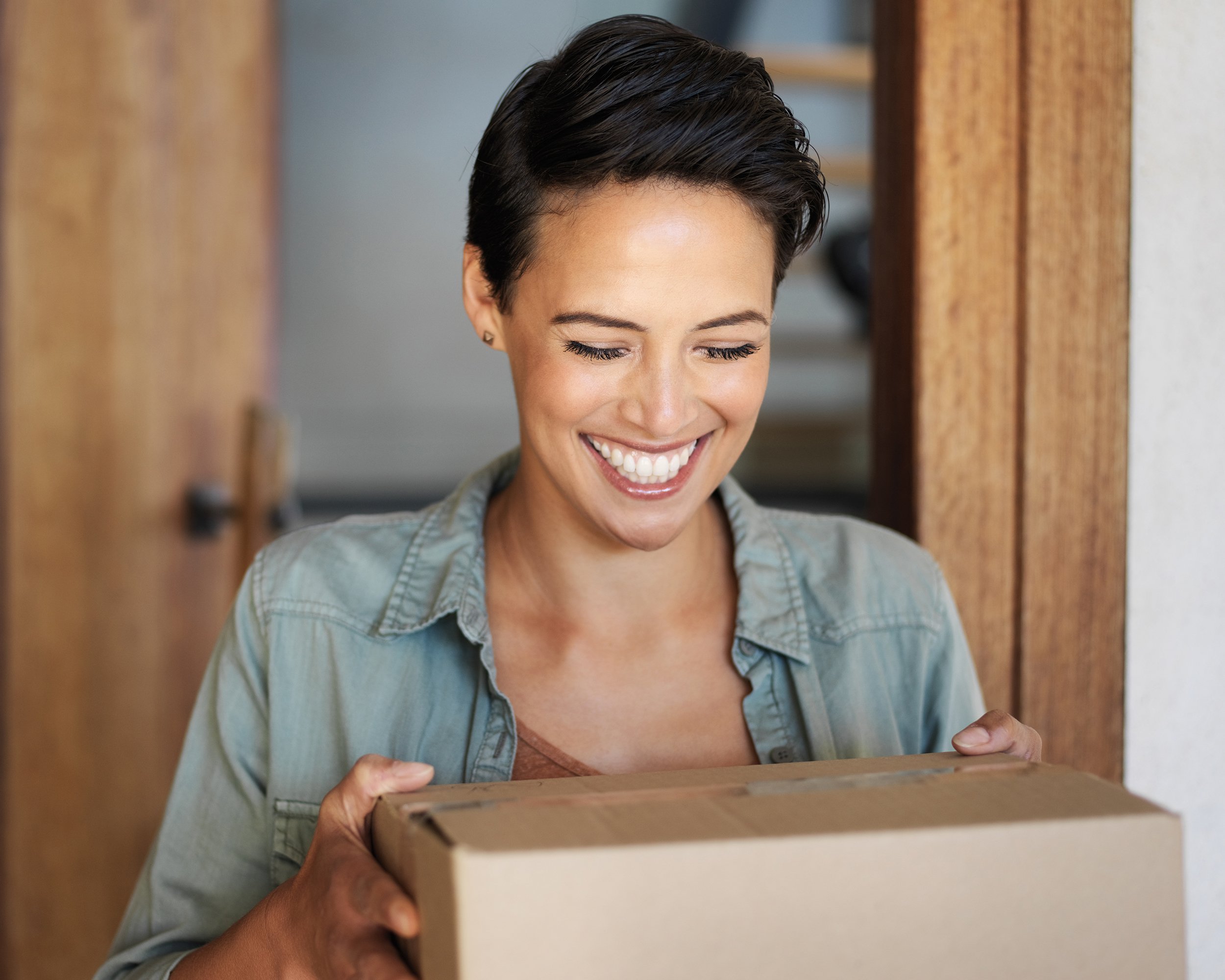 woman holding shipping box
