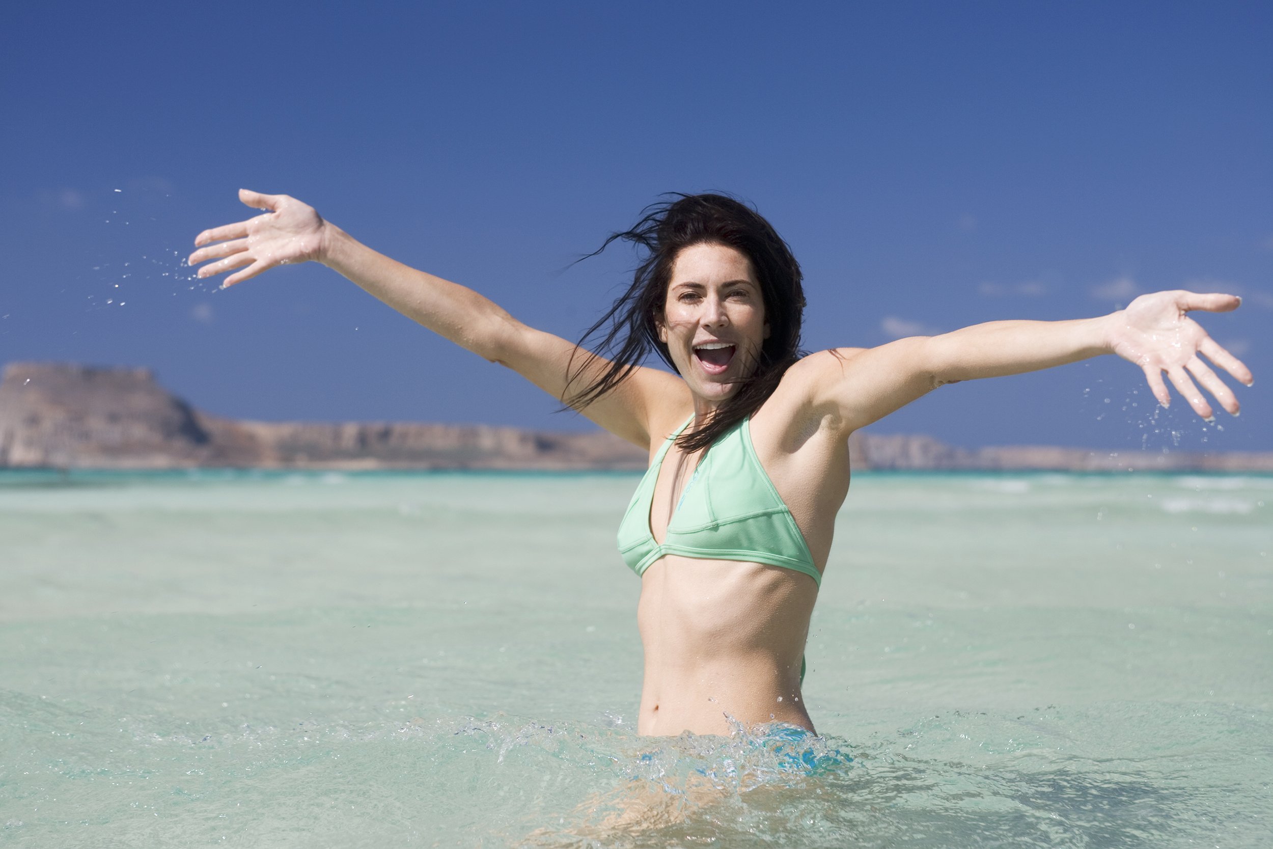 woman wading in the sea