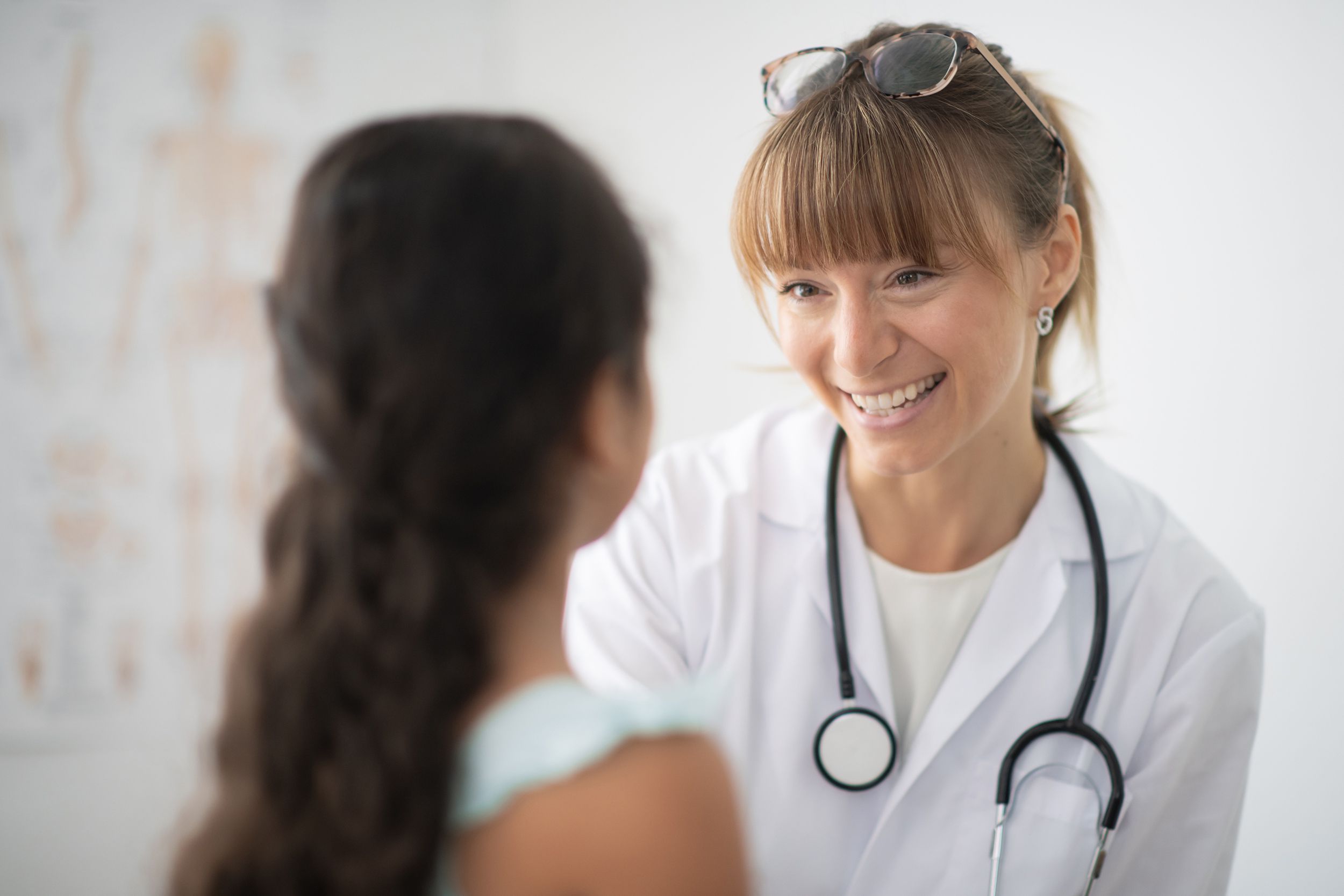 female pediatrician with patient