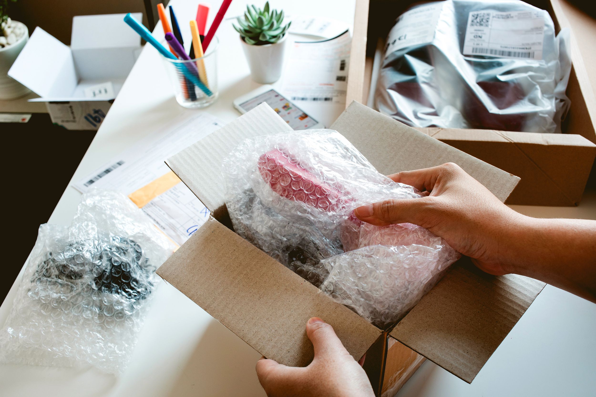 online shopping concepts with female open box, presents some product in her hand