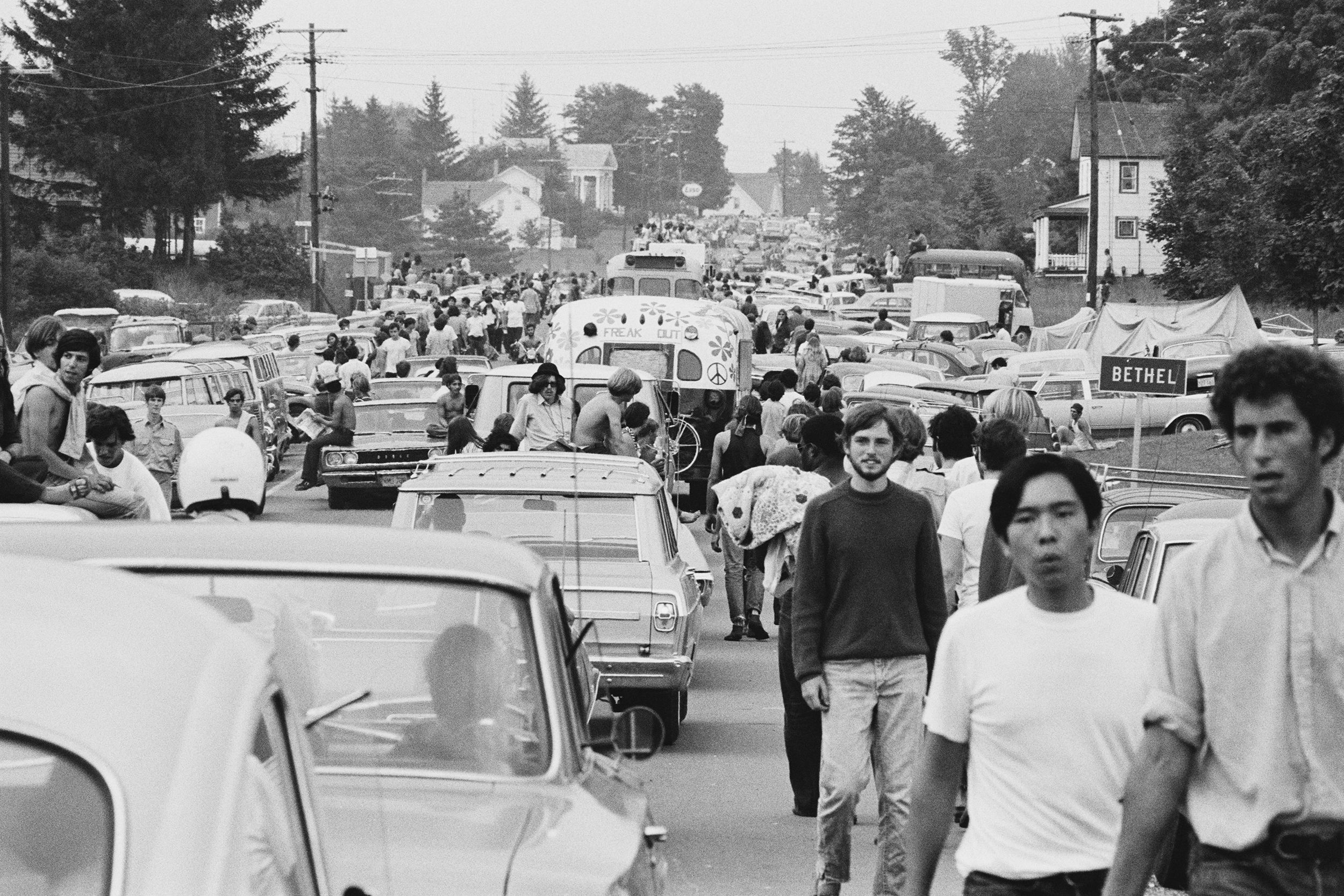 festival-goers abandon their vehicles in a traffic jam on the way to the Woodstock Music Festival, Bethel, New York