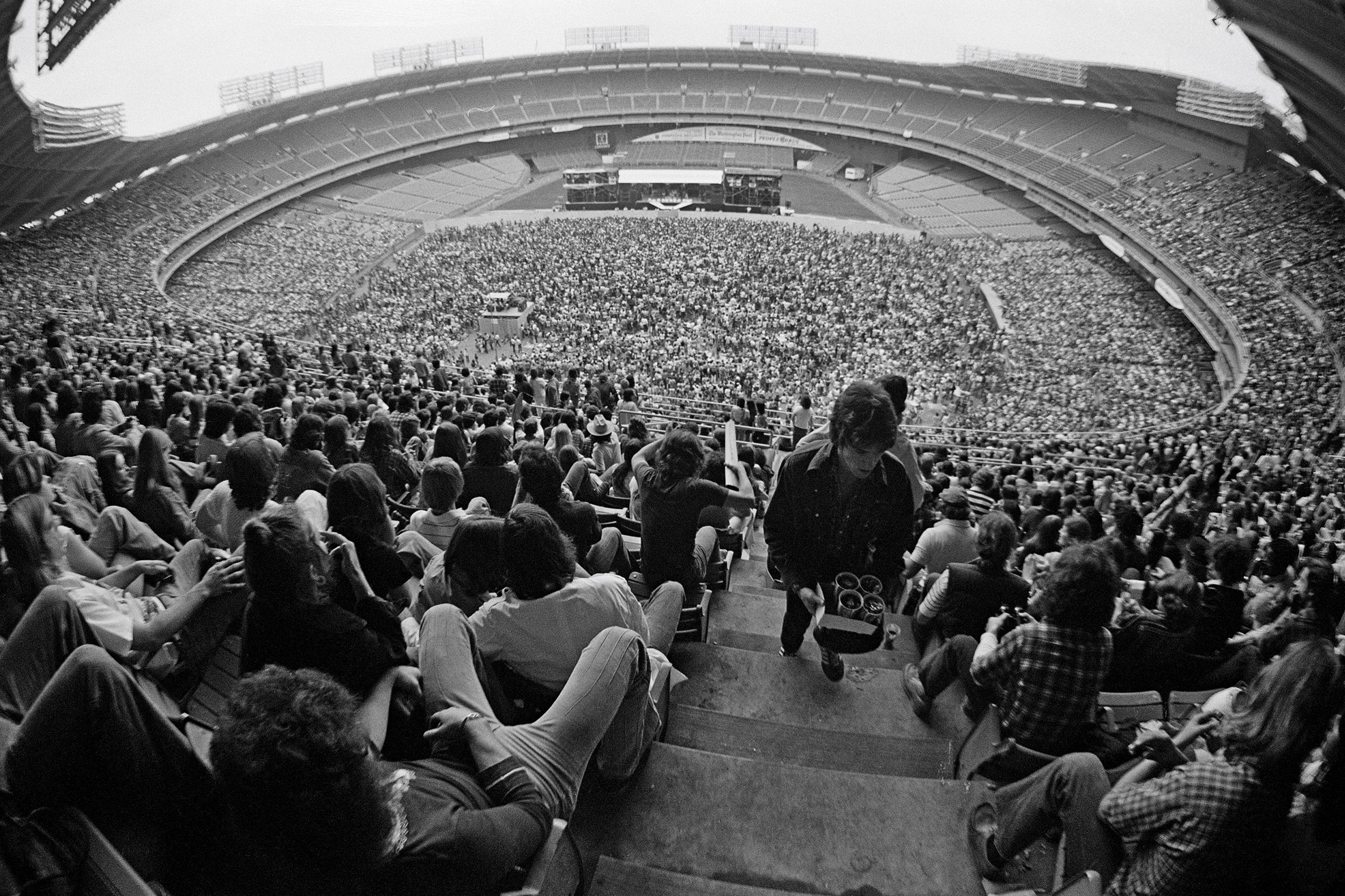 view of music fans at RFK Stadium in Washington DC, USA during a concert by Aerosmith on 30th May 1976