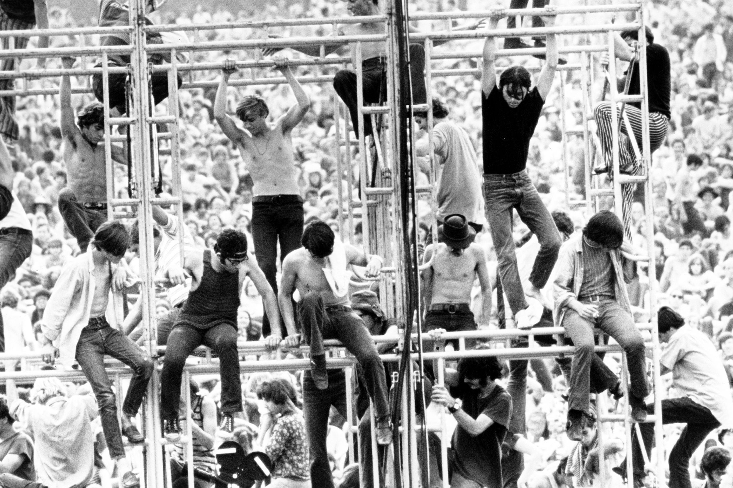 people climbing bars at Woodstock