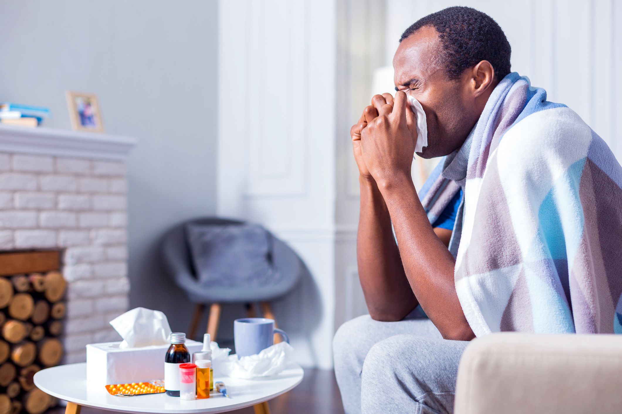 adult man with cold sneezing