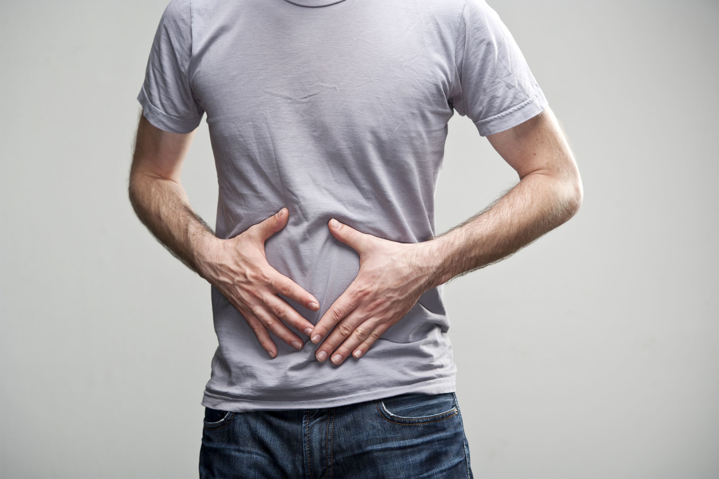 Man holding his stomach area