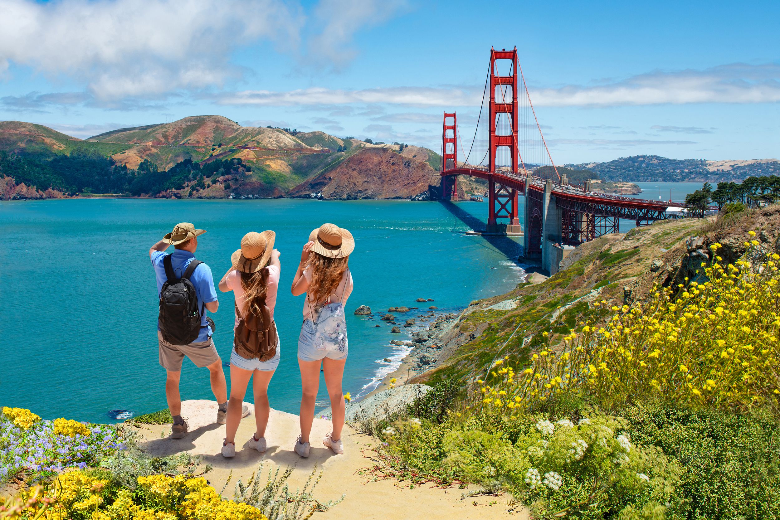 family enjoying time together on vacation hiking trip overlooking the Golden Gate bridge